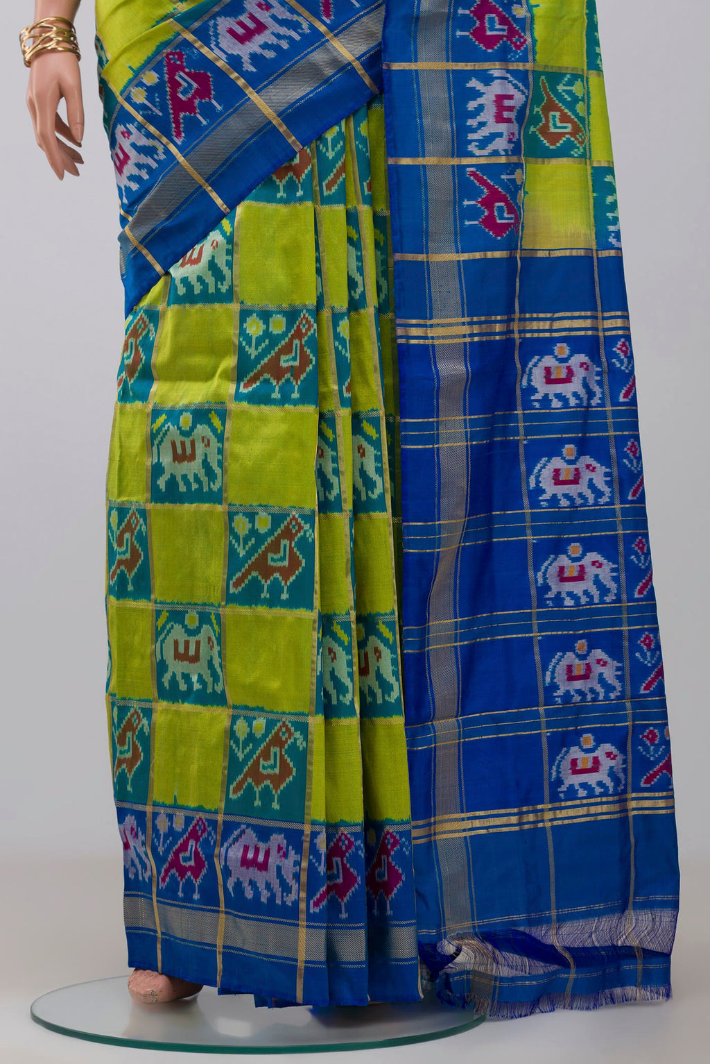 Pleats and pallu of Green Pochampally Silk Saree with Ikat design on the body and Zari Border. 