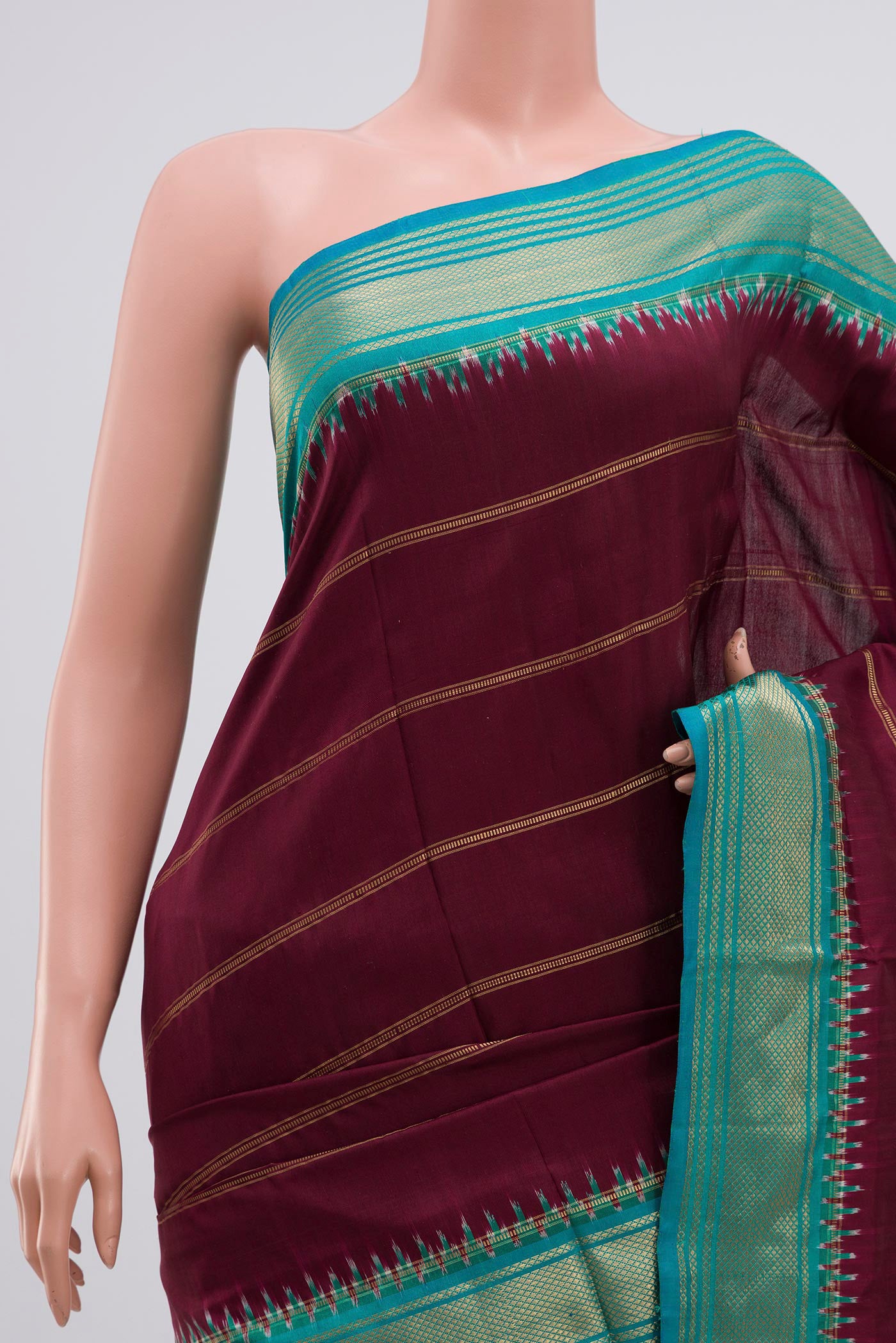 Border image of Maroon Pochampally Silk Saree with Stripes on the body and Zari Border. 