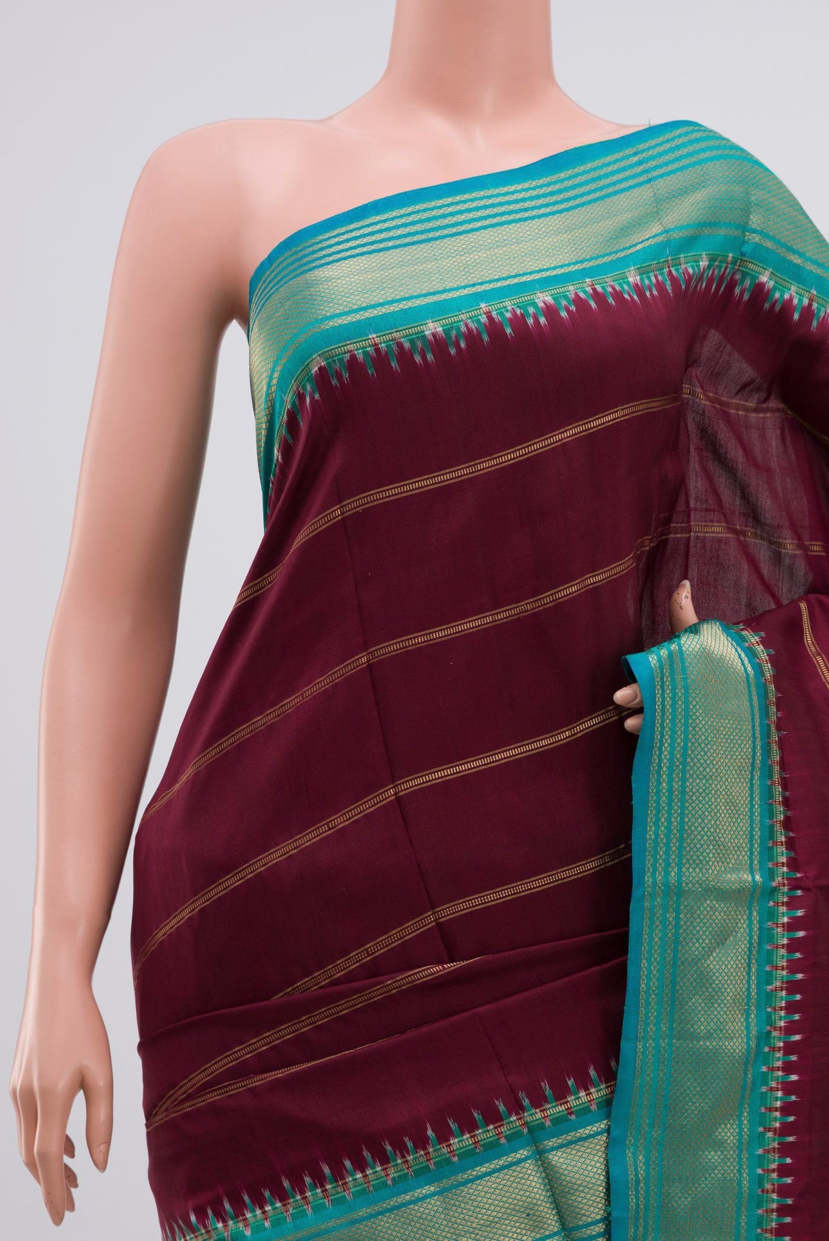Border image of Maroon Pochampally Silk Saree with Stripes on the body and Zari Border. 