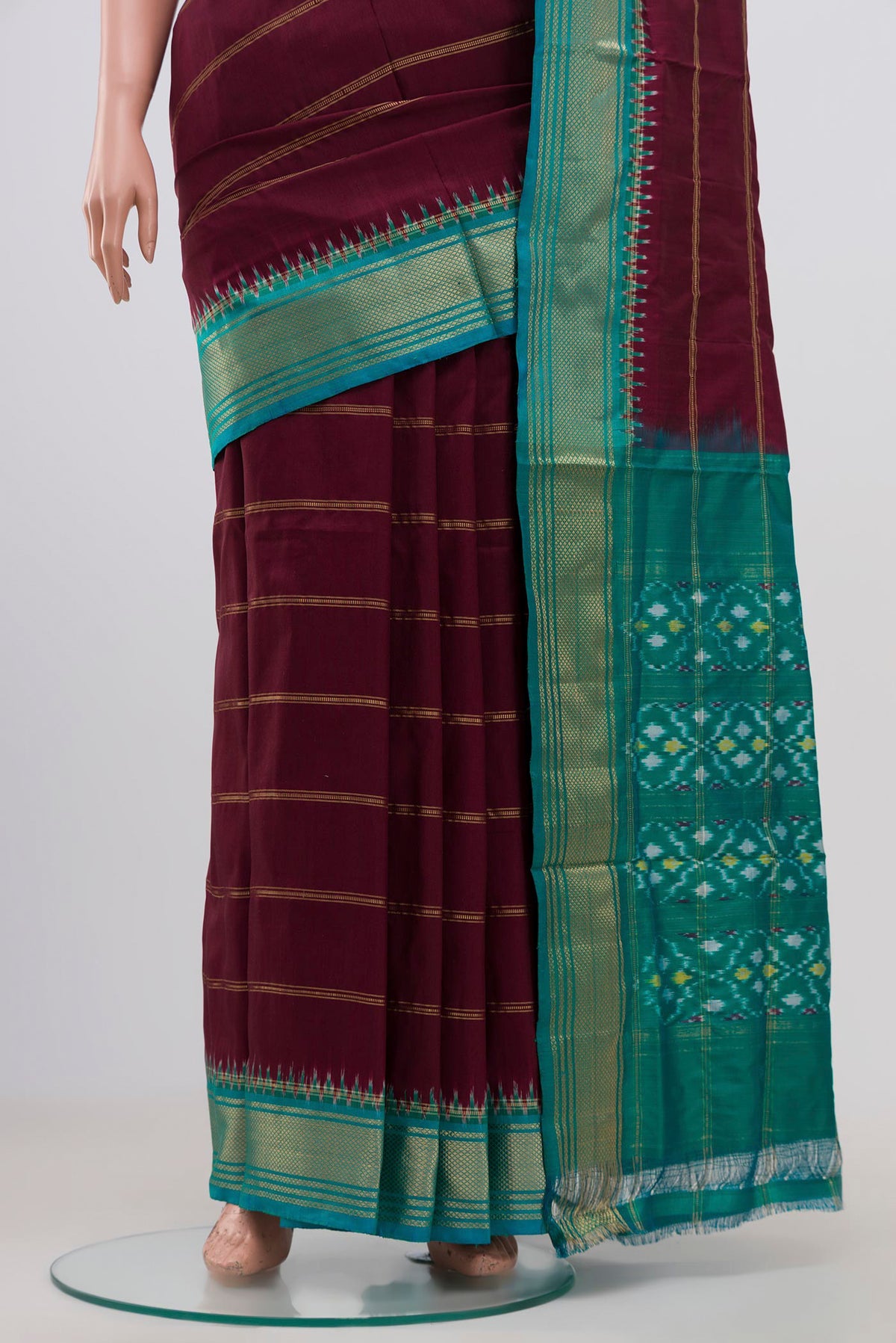 Pleats and pallu of Maroon Pochampally Silk Saree with Stripes on the body and Zari Border. 