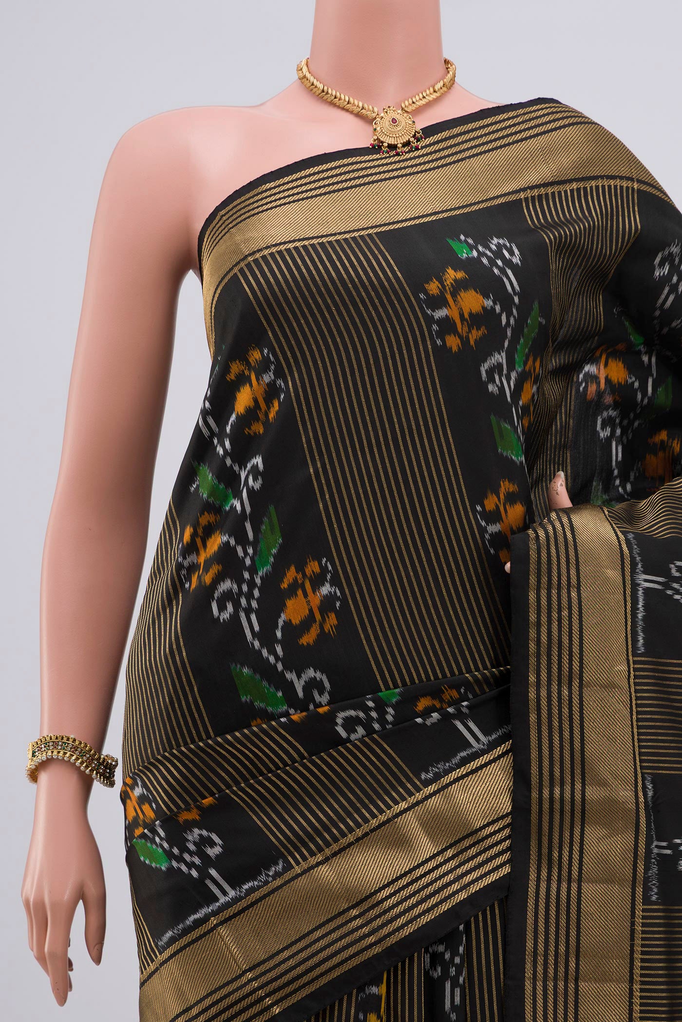 Border image of Black Pochampally Silk Saree with Ikat Print on the body and Zari Border. 