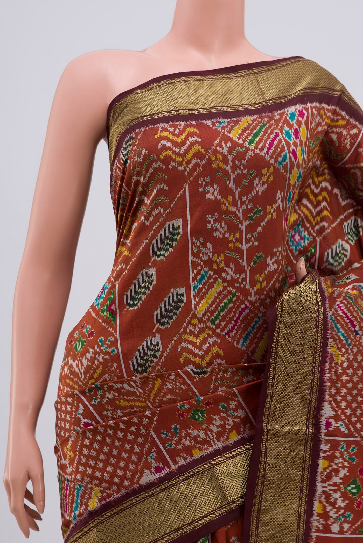 Border image of Brown Pochampally Silk Saree with Ikat Print on the body and Zari Border. 