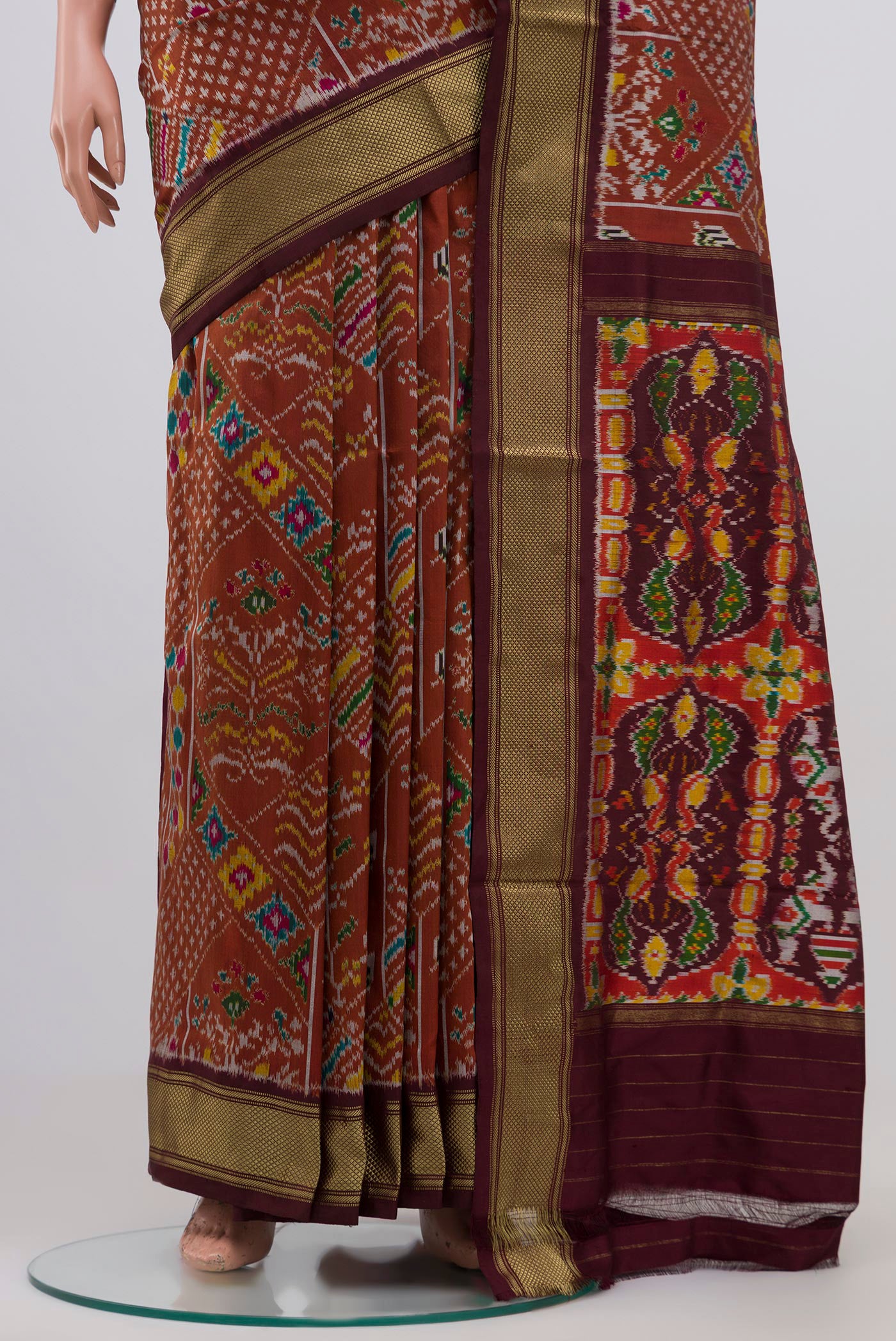 Pleats and pallu of Brown Pochampally Silk Saree with Ikat Print on the body and Zari Border. 
