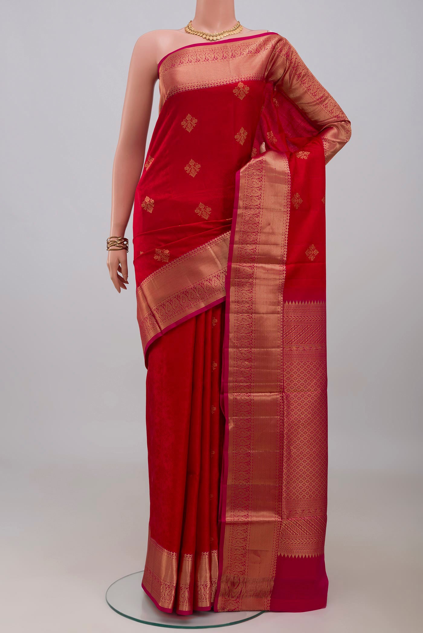 Red Soft Silk Saree with Jacquard With Zari Butta on the body and Zari Border.  displayed on a mannequin
