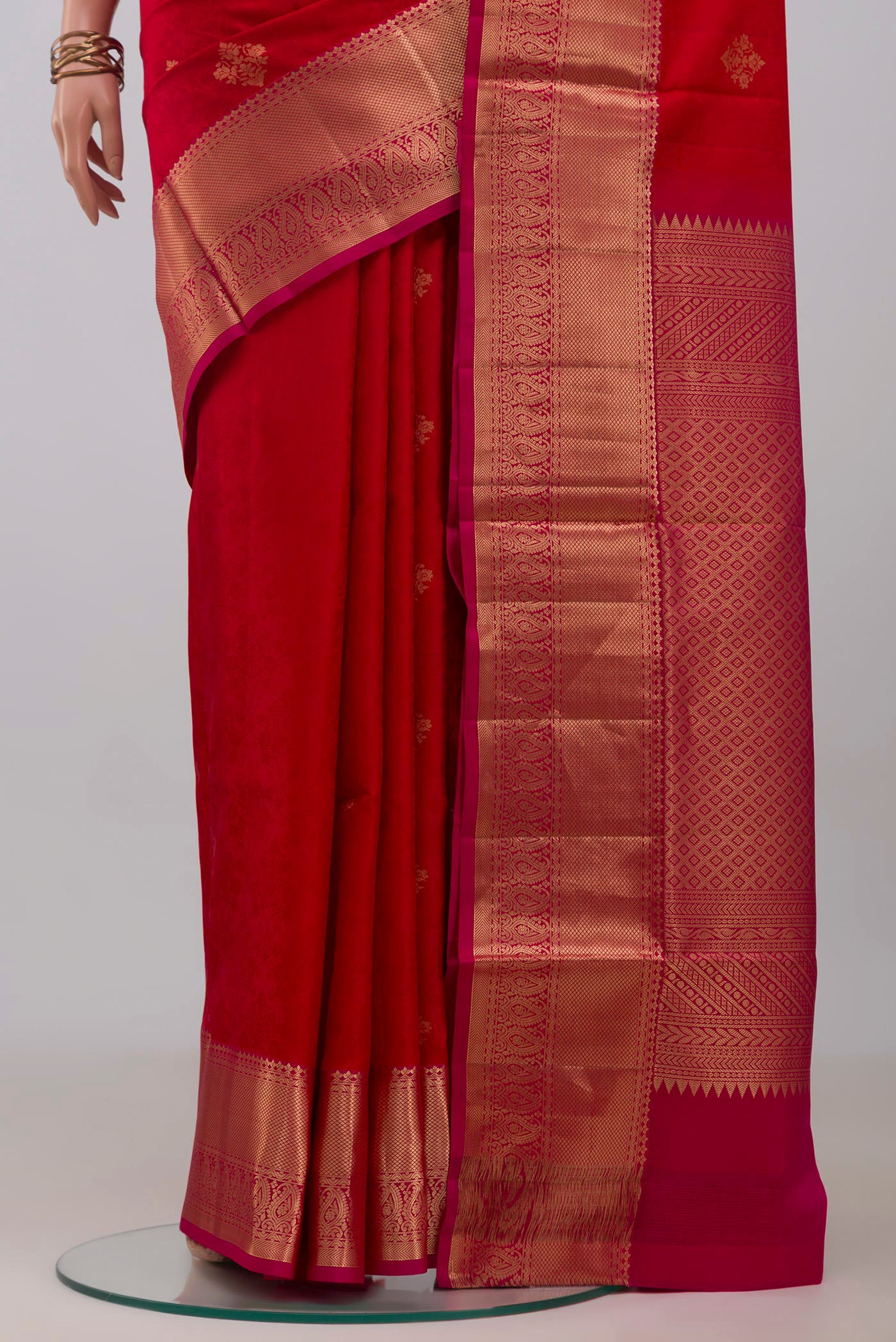 Pleats and pallu of Red Soft Silk Saree with Jacquard With Zari Butta on the body and Zari Border. 
