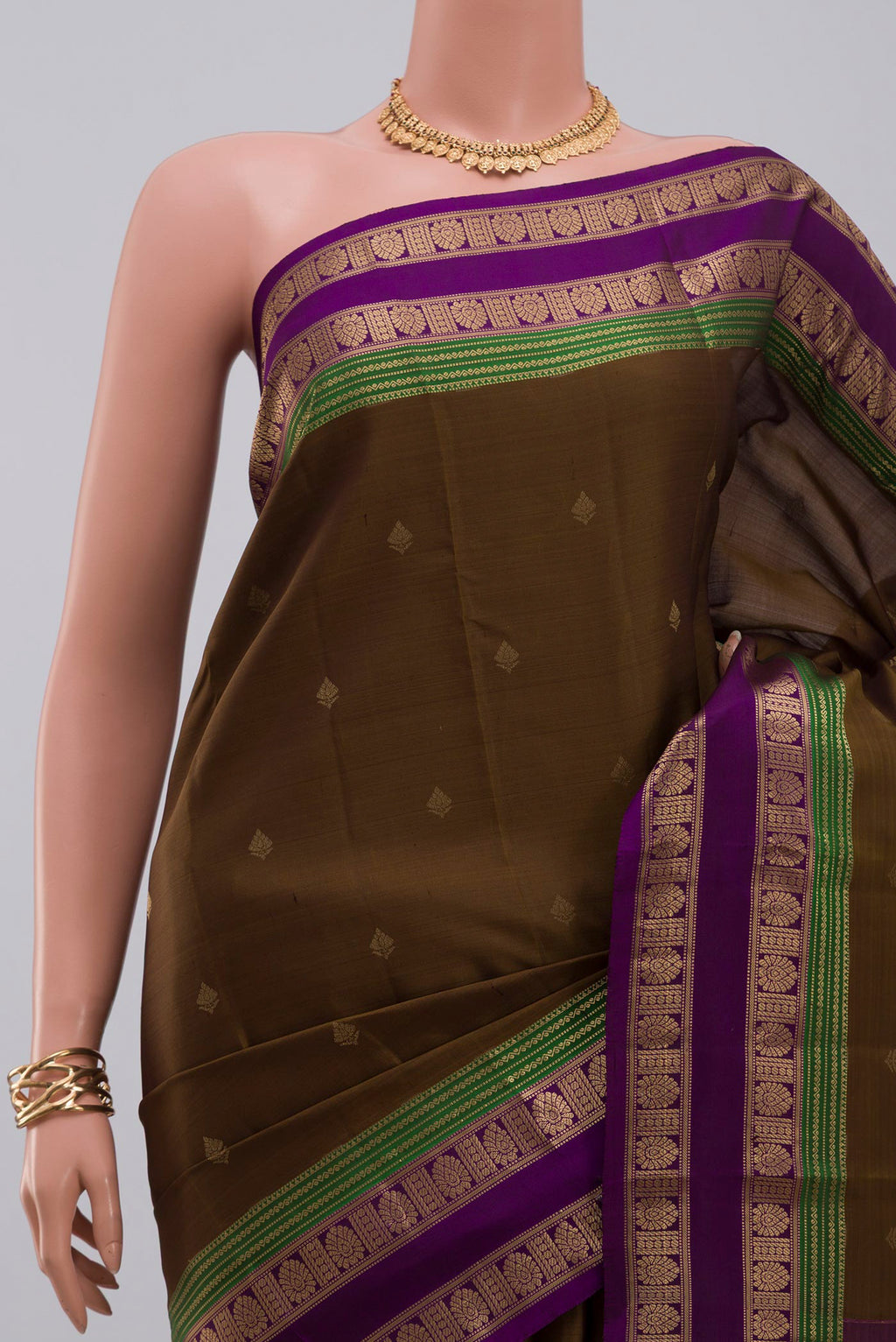 Border image of Mehandi Green Kanchipuram Silk Saree with Zari Butta on the body and Zari Border. 
