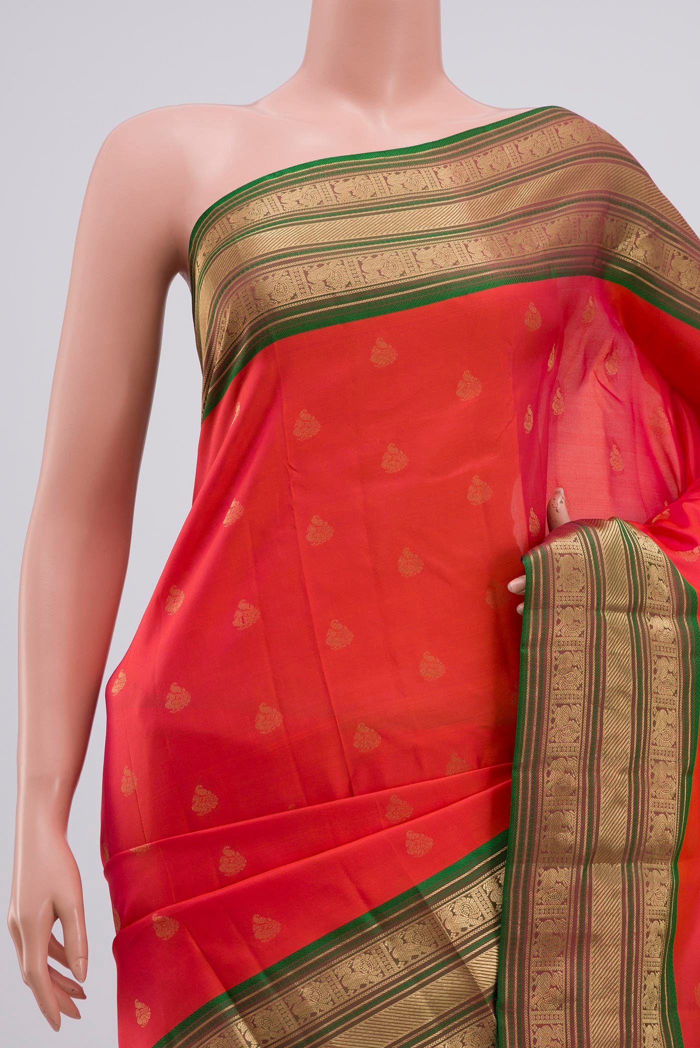 Border image of Orange Kanchipuram Saree with Zari Butta on the body and Zari Border. 