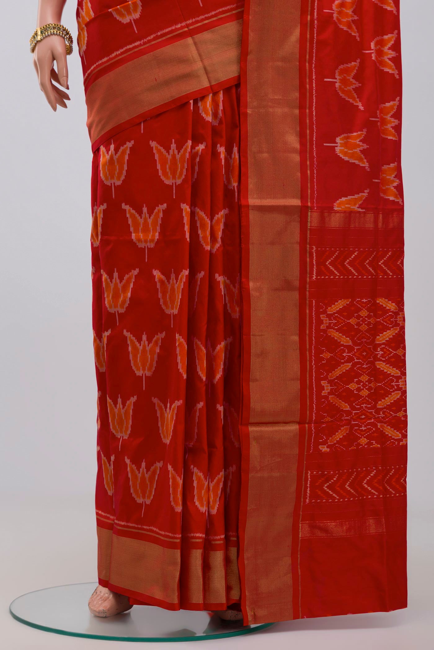 Pleats and pallu of Red Pochampally Saree with Ikat design on the body and Zari Border. 