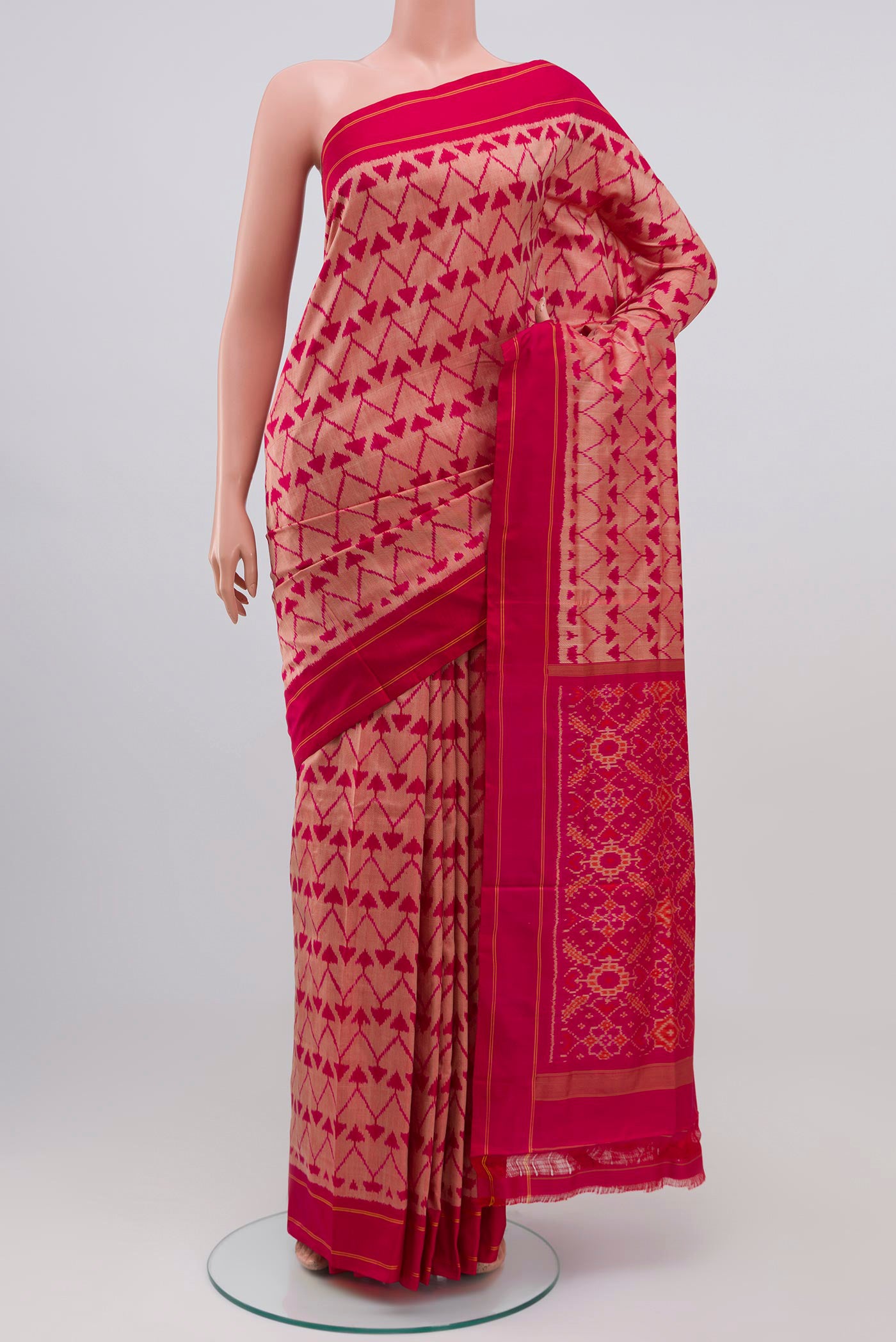 Pink Pochampally Silk Saree with Ikat design on the body and Plain Border.  displayed on a mannequin