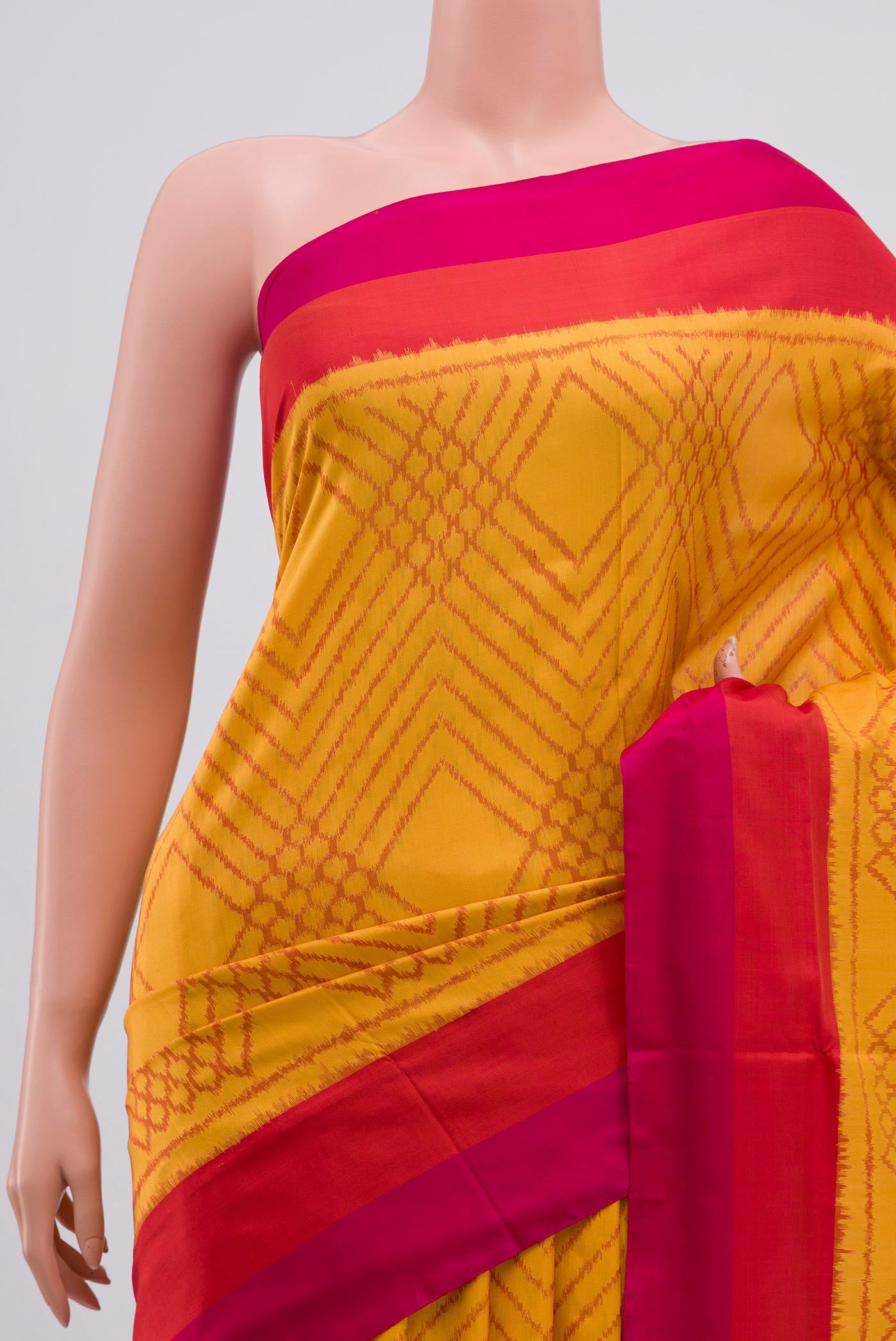 Border image of Yellow Pochampally Silk Saree with Ikat Print on the body and Zari Border. 
