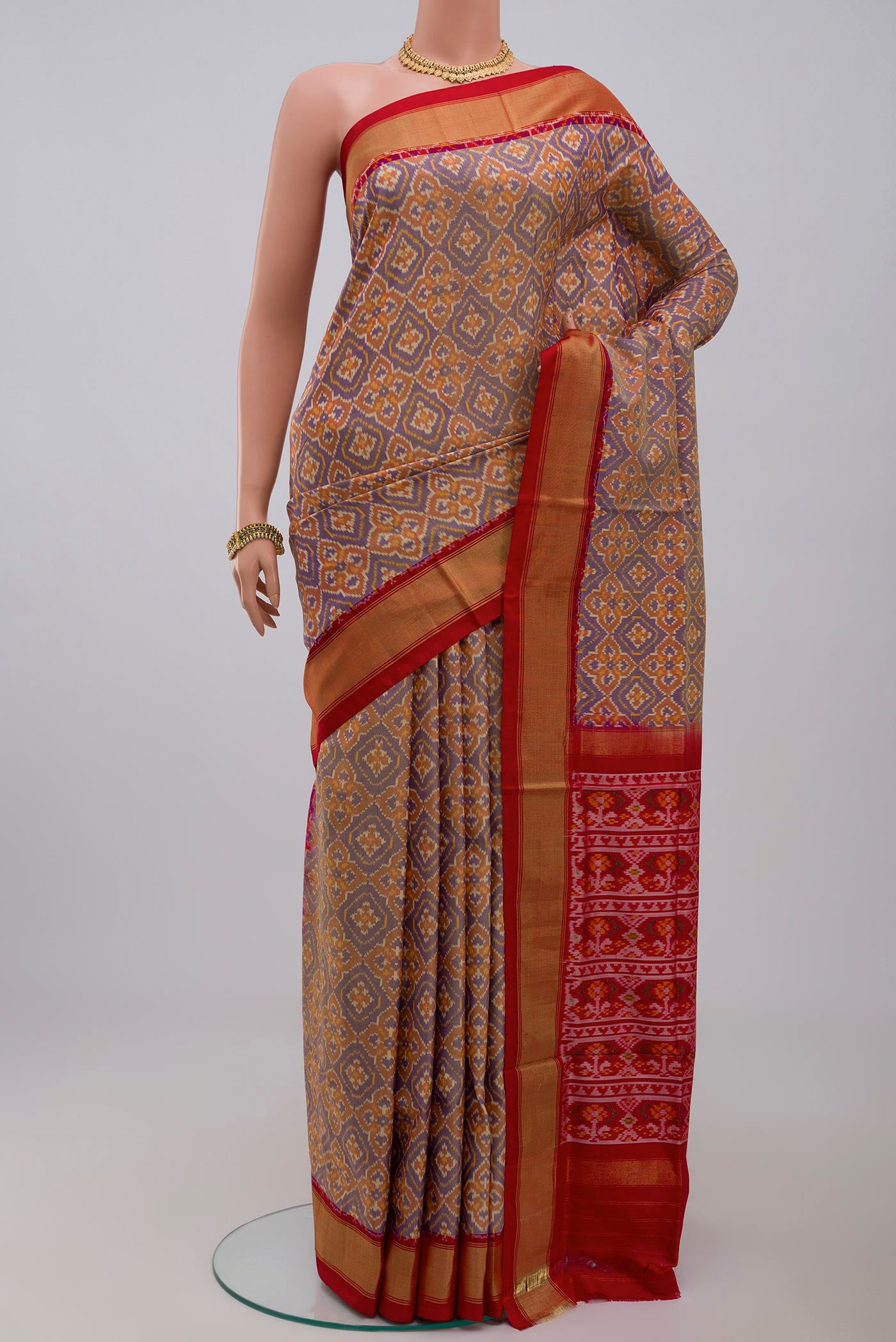 Blue Pochampally Saree with Ikat design on the body and Zari Border.  displayed on a mannequin