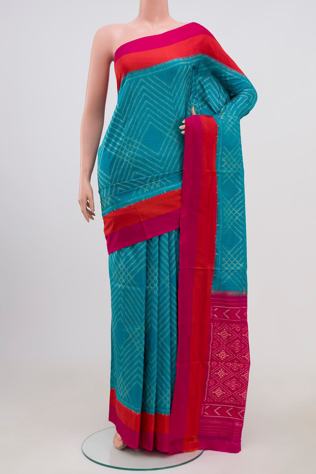 Sky Blue Pochampally Silk Saree with Ikat Print on the body and Plain Border.  displayed on a mannequin