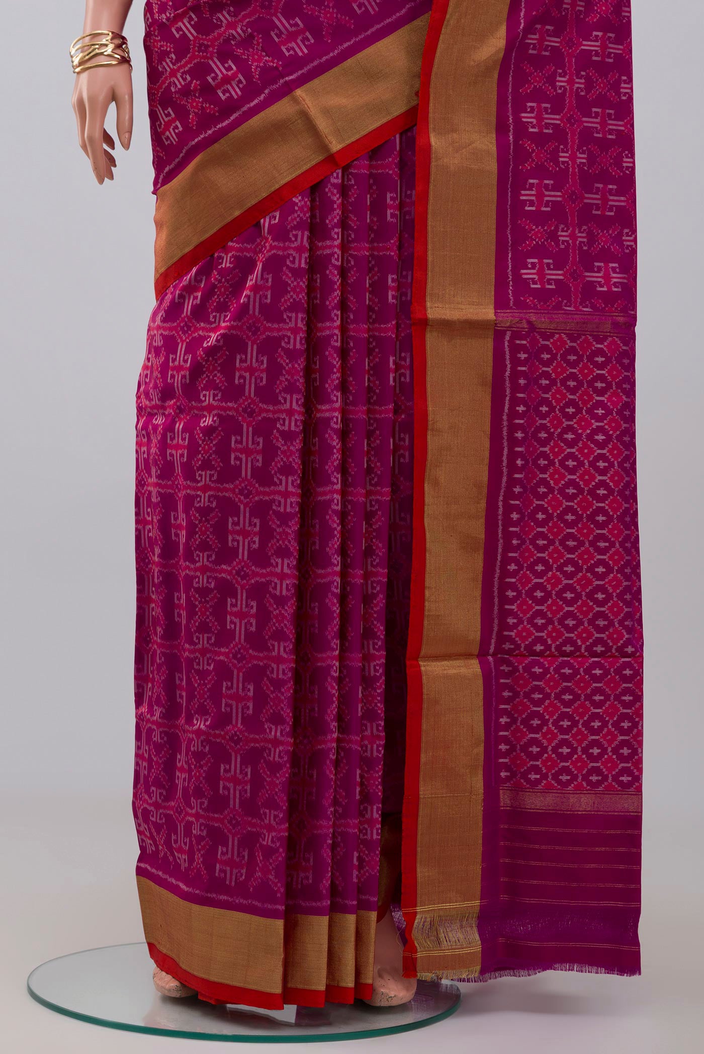 Pleats and pallu of Purple Pochampally Silk Saree with Ikat design on the body and Zari Border. 