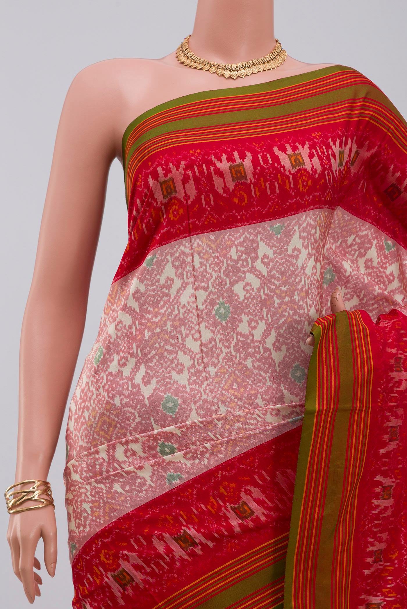 Border image of Peach Pochampally Silk Saree with Ikat design on the body and Plain Border. 