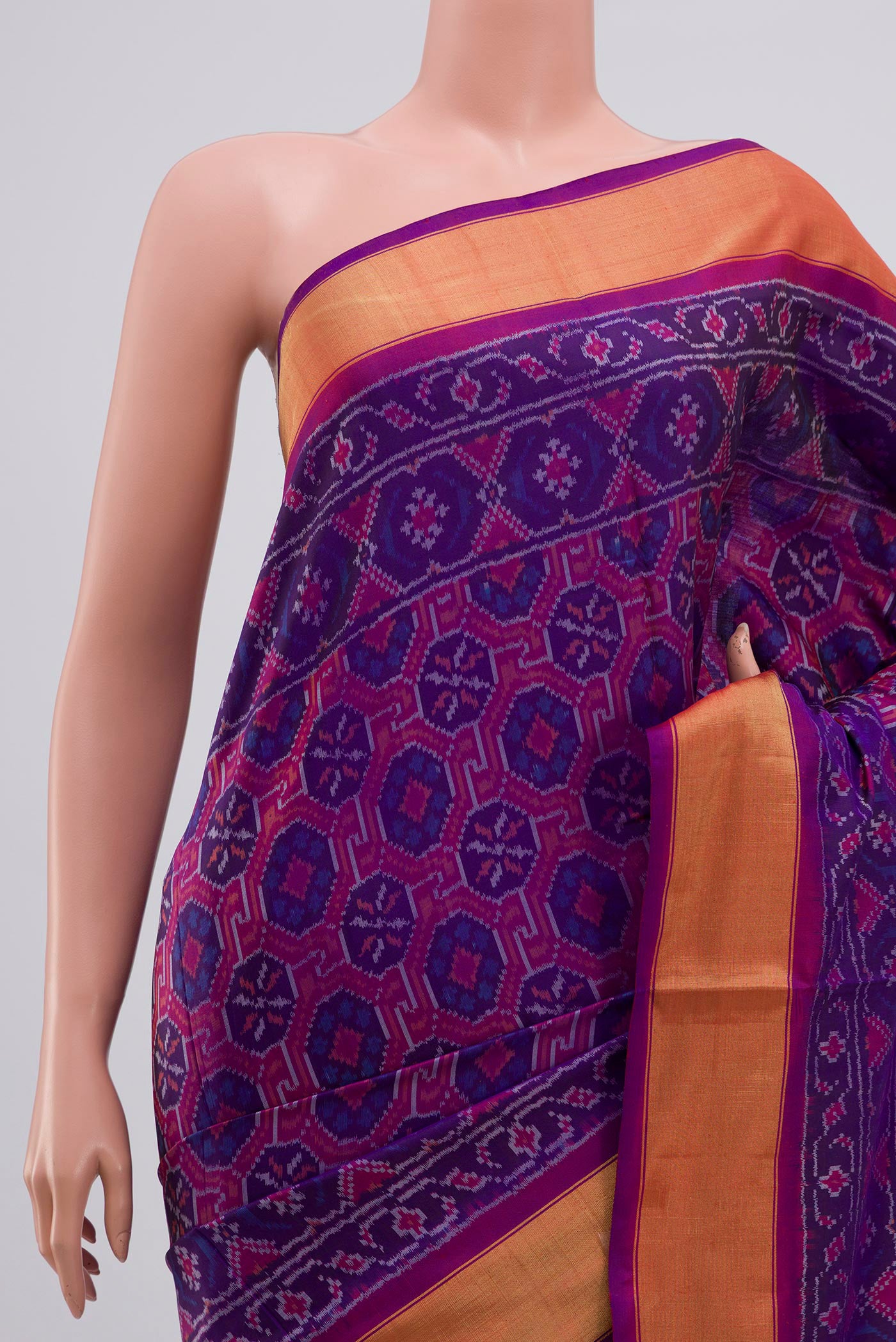 Border image of Purple Pochampally Silk Saree with Ikat design on the body and Zari Border. 