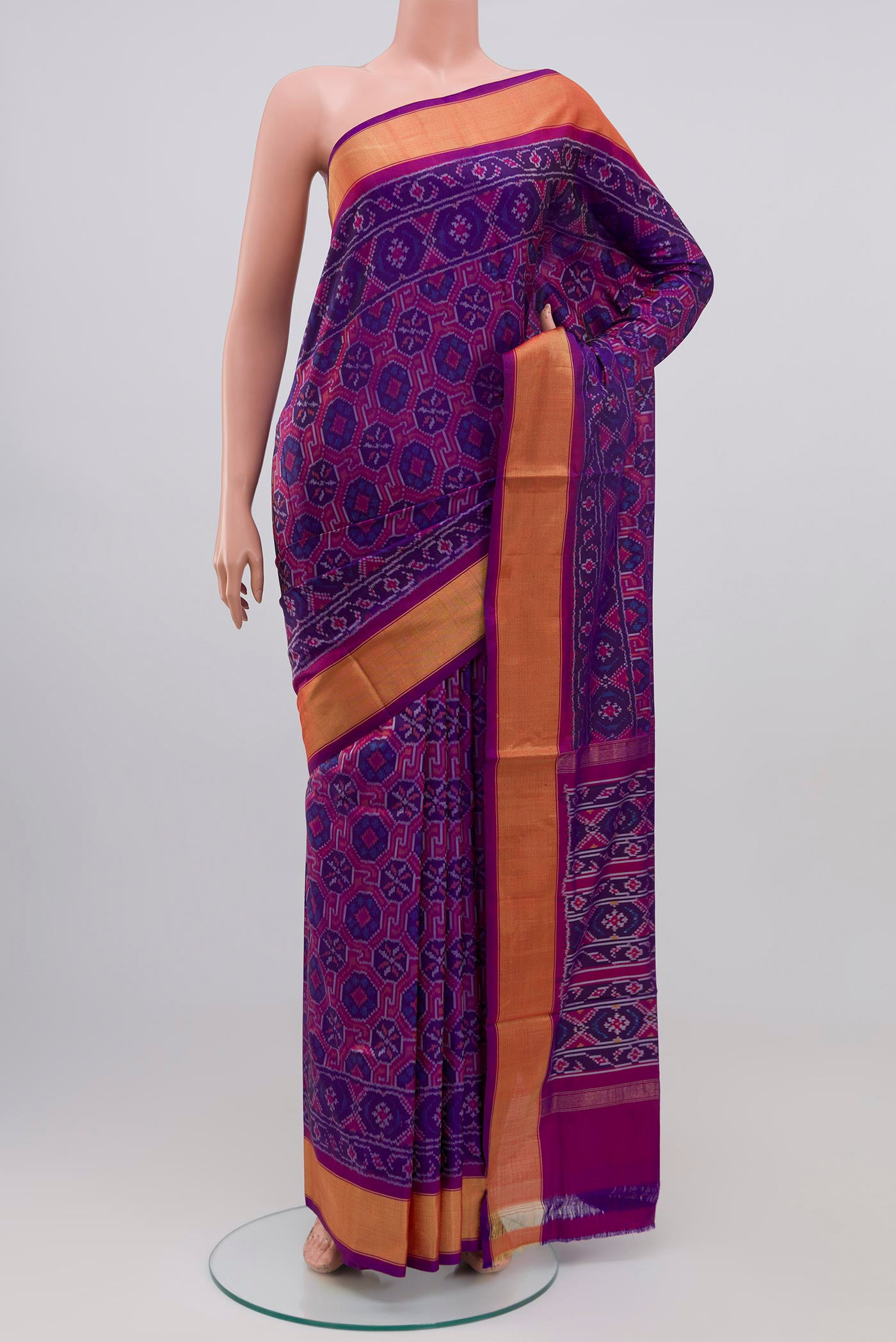 Purple Pochampally Silk Saree with Ikat design on the body and Zari Border.  displayed on a mannequin
