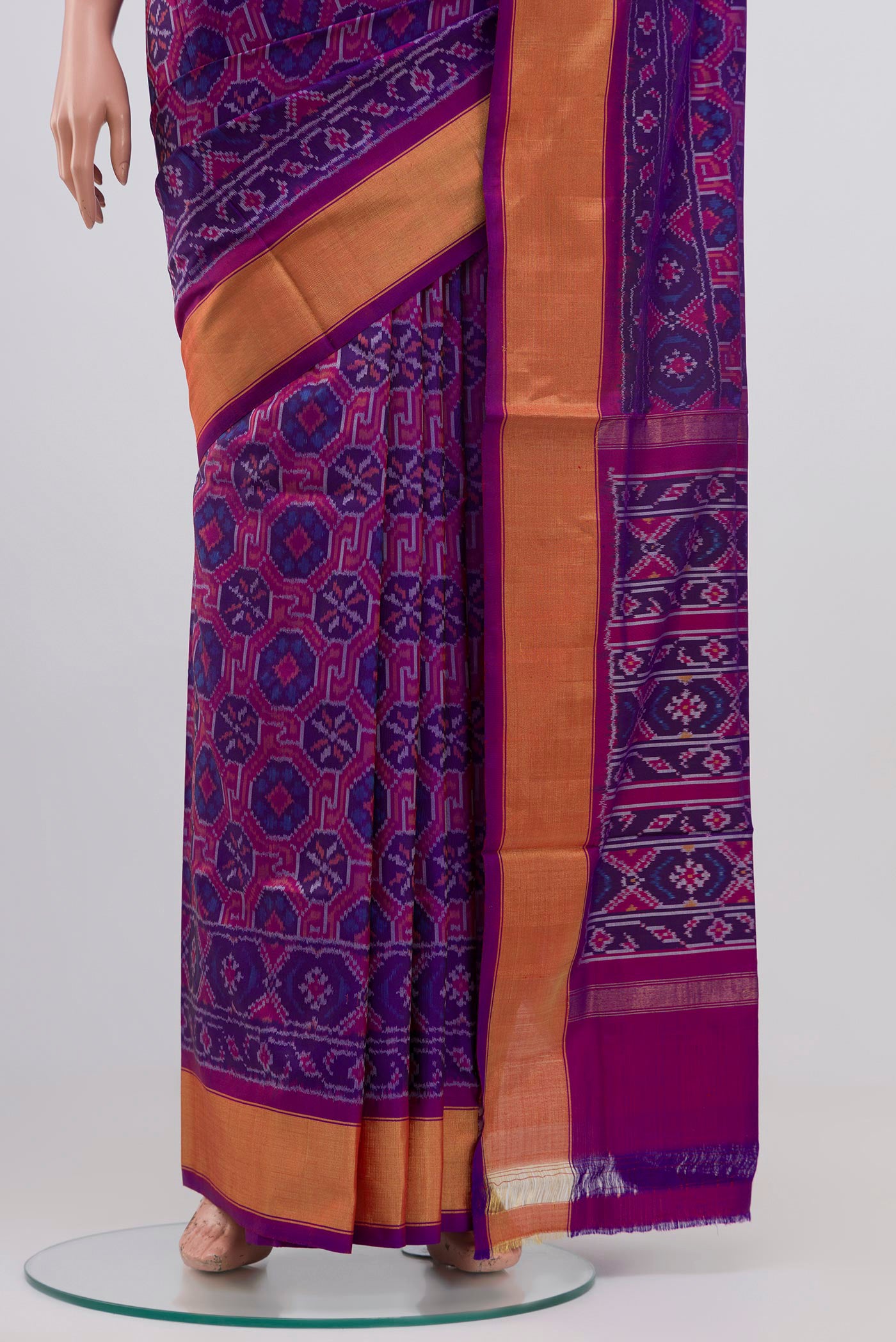 Pleats and pallu of Purple Pochampally Silk Saree with Ikat design on the body and Zari Border. 