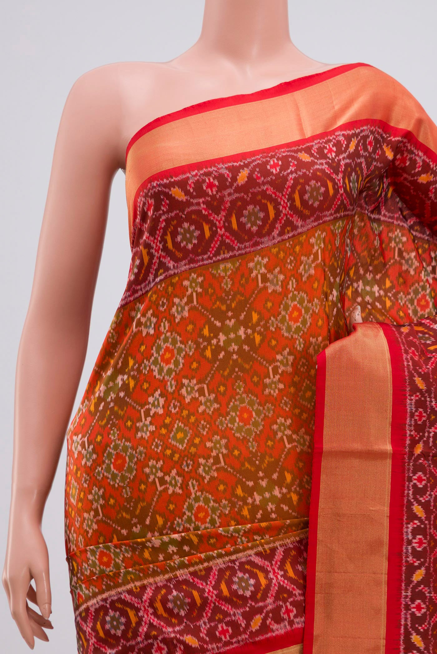 Border image of Red Pochampally Silk Saree with Ikat Print on the body and Zari Border. 