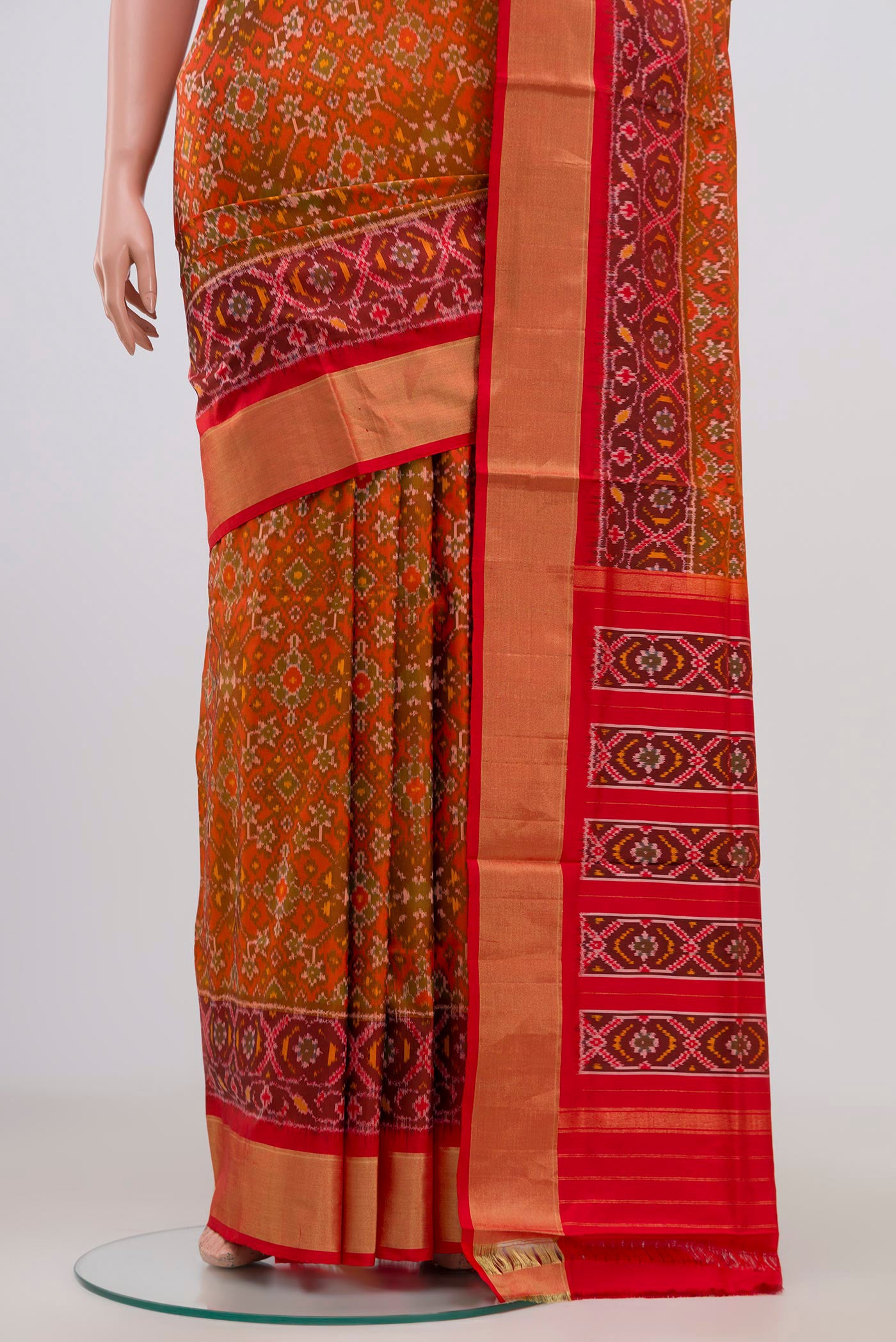 Pleats and pallu of Red Pochampally Silk Saree with Ikat Print on the body and Zari Border. 