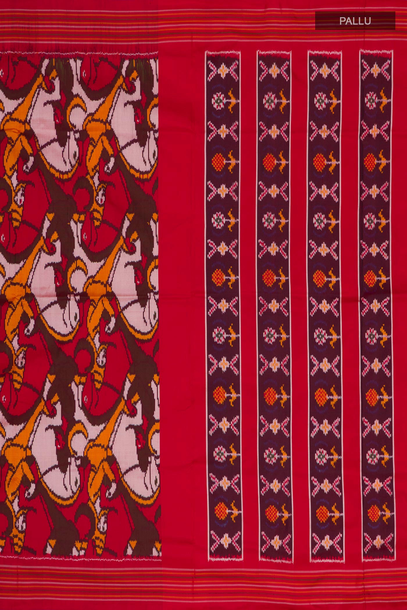 Close up image of the pallu of Red Pochampally Silk Saree with Pure Ikat on the body and Plain Border. 