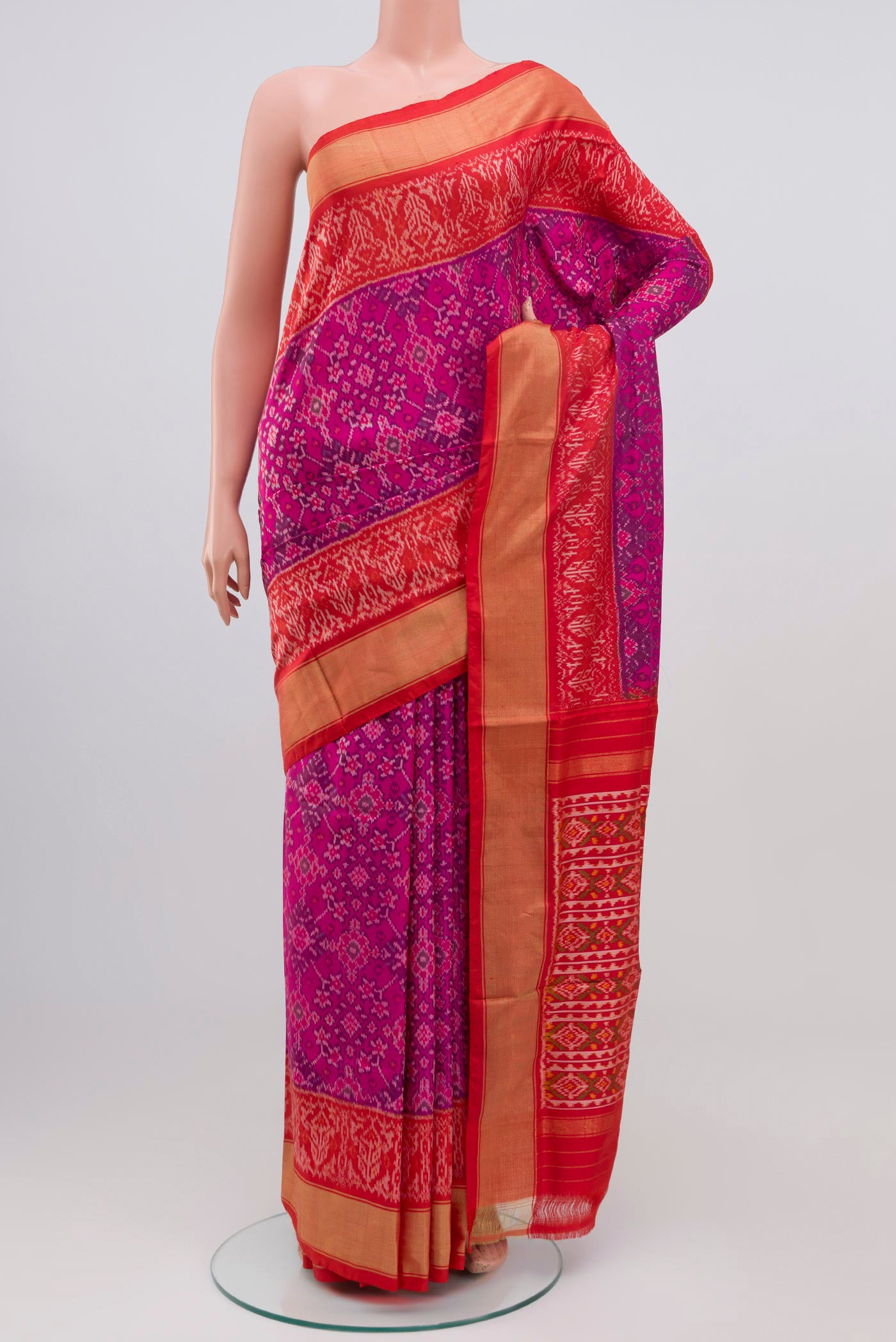 Pink Pochampally Silk Saree with Ikat design on the body and Zari Border.  displayed on a mannequin