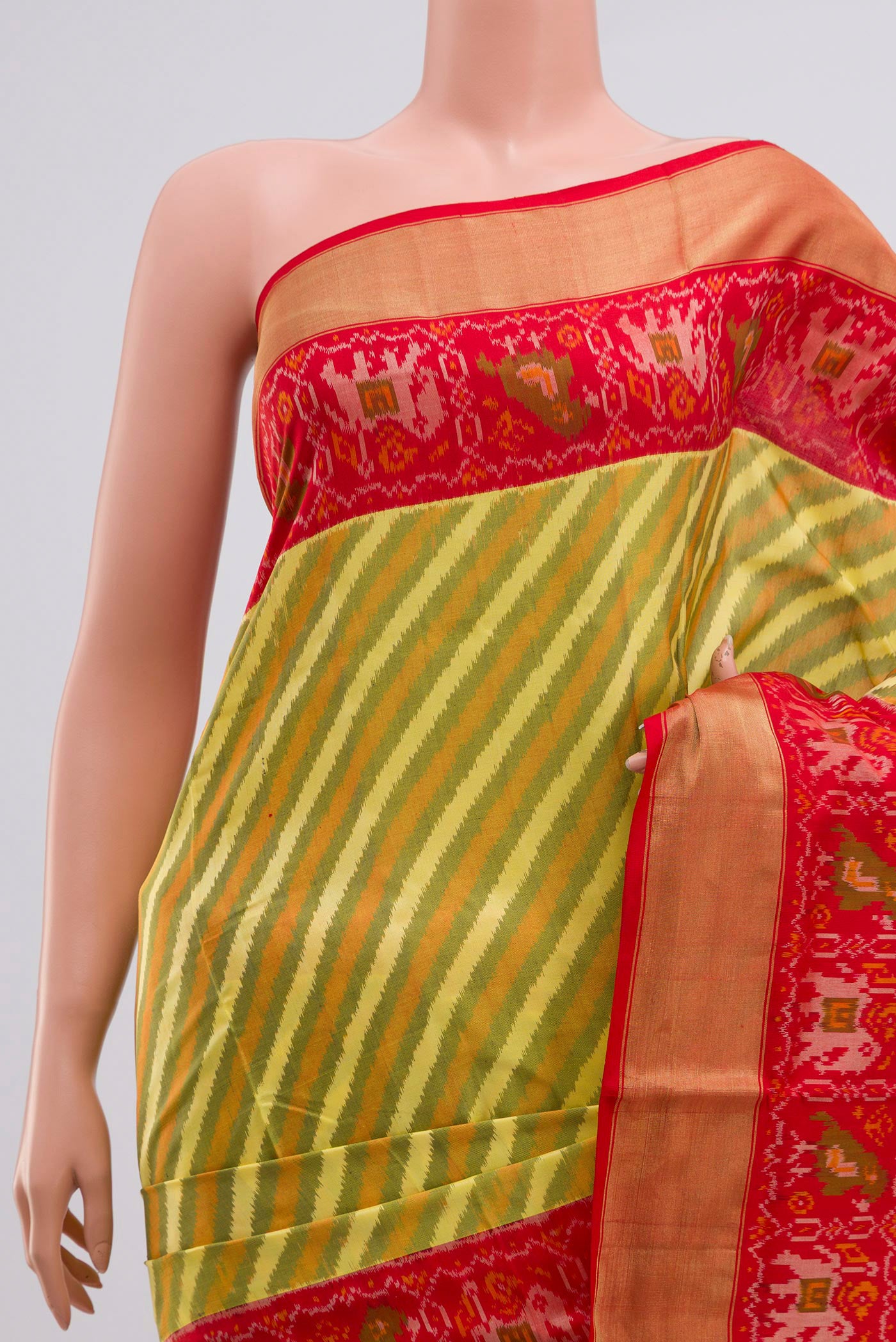 Border image of Green Pochampally Silk Saree with Ikat Print on the body and Zari Border. 