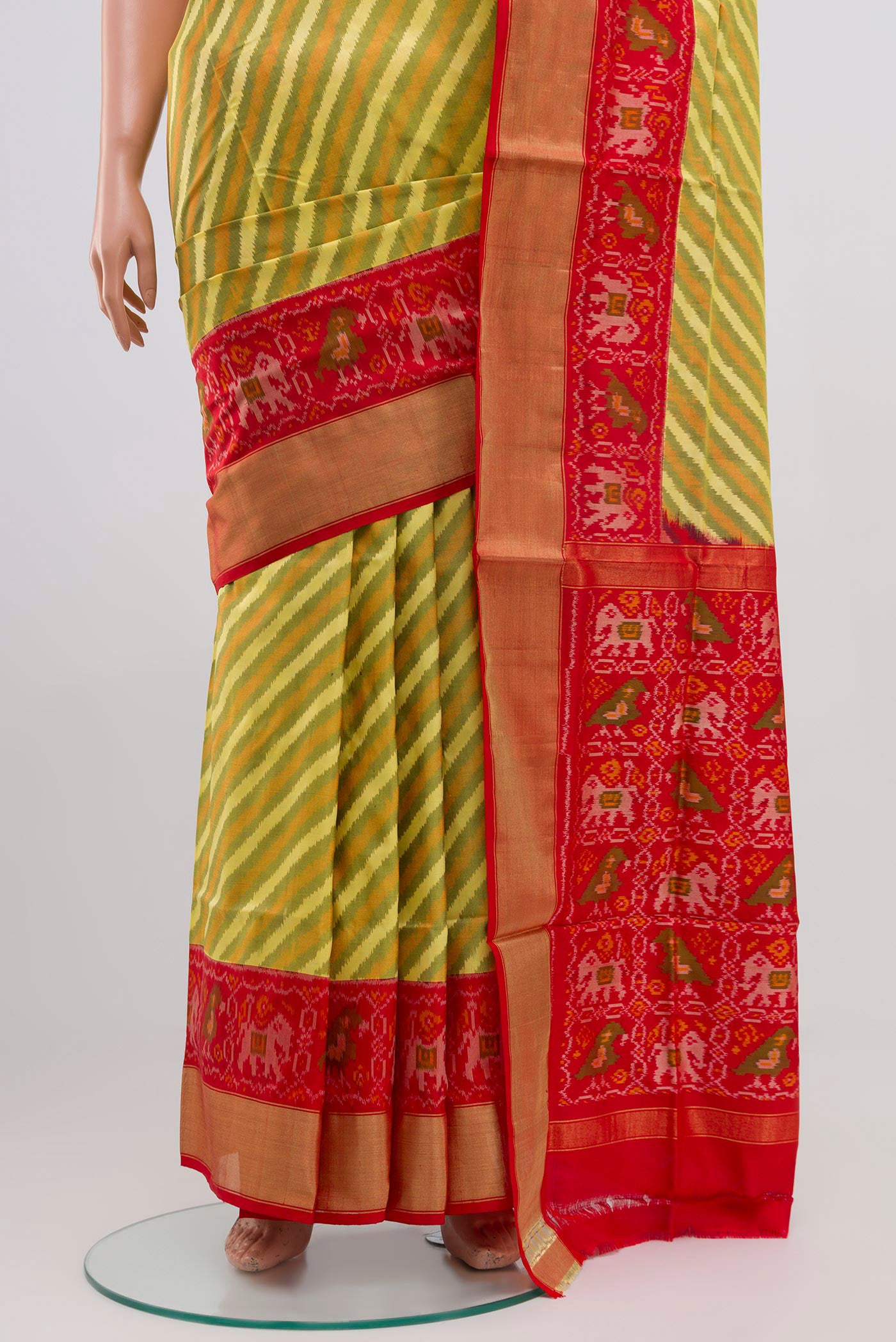Pleats and pallu of Green Pochampally Silk Saree with Ikat Print on the body and Zari Border. 