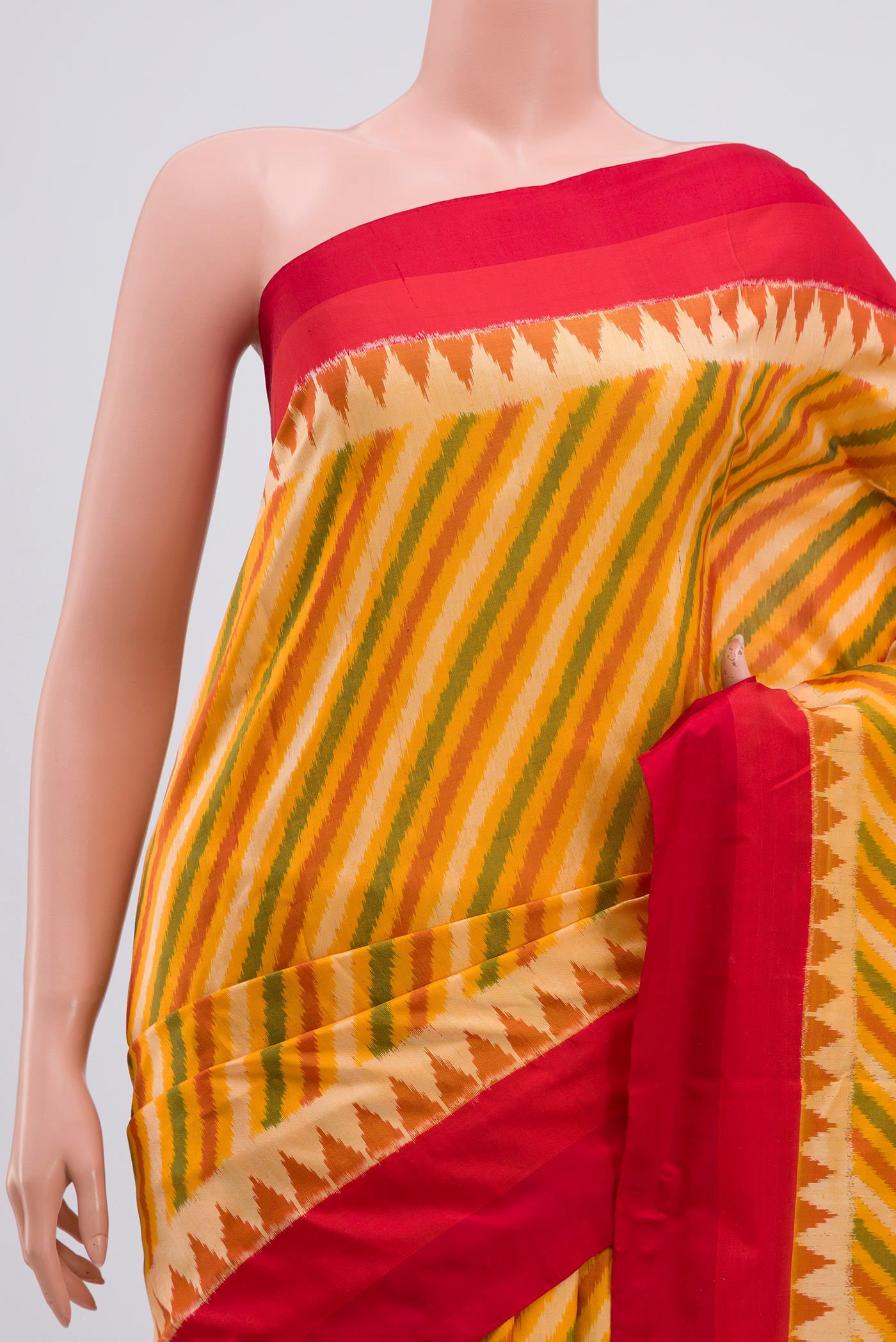 Border image of Yellow Pochampally Silk Saree with Ikat Print on the body and Zari Border. 