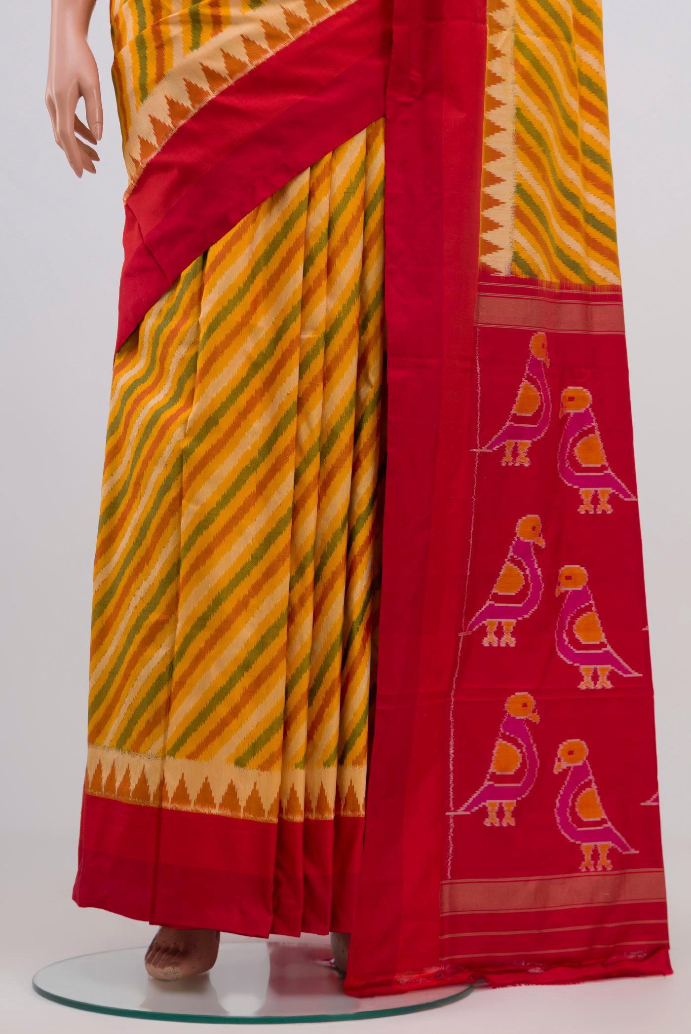 Pleats and pallu of Yellow Pochampally Silk Saree with Ikat Print on the body and Zari Border. 