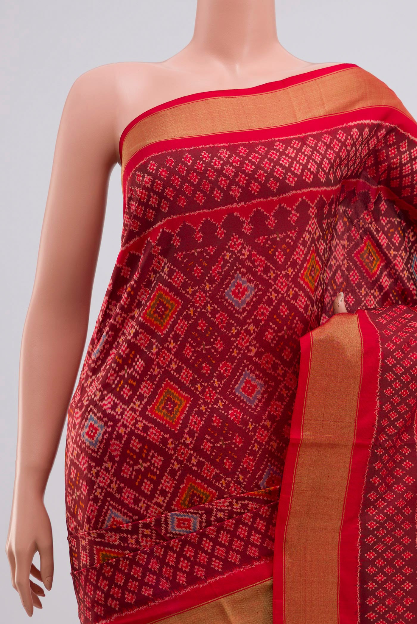 Border image of Red Pochampally Silk Saree with Ikat Print on the body and Zari Border. 