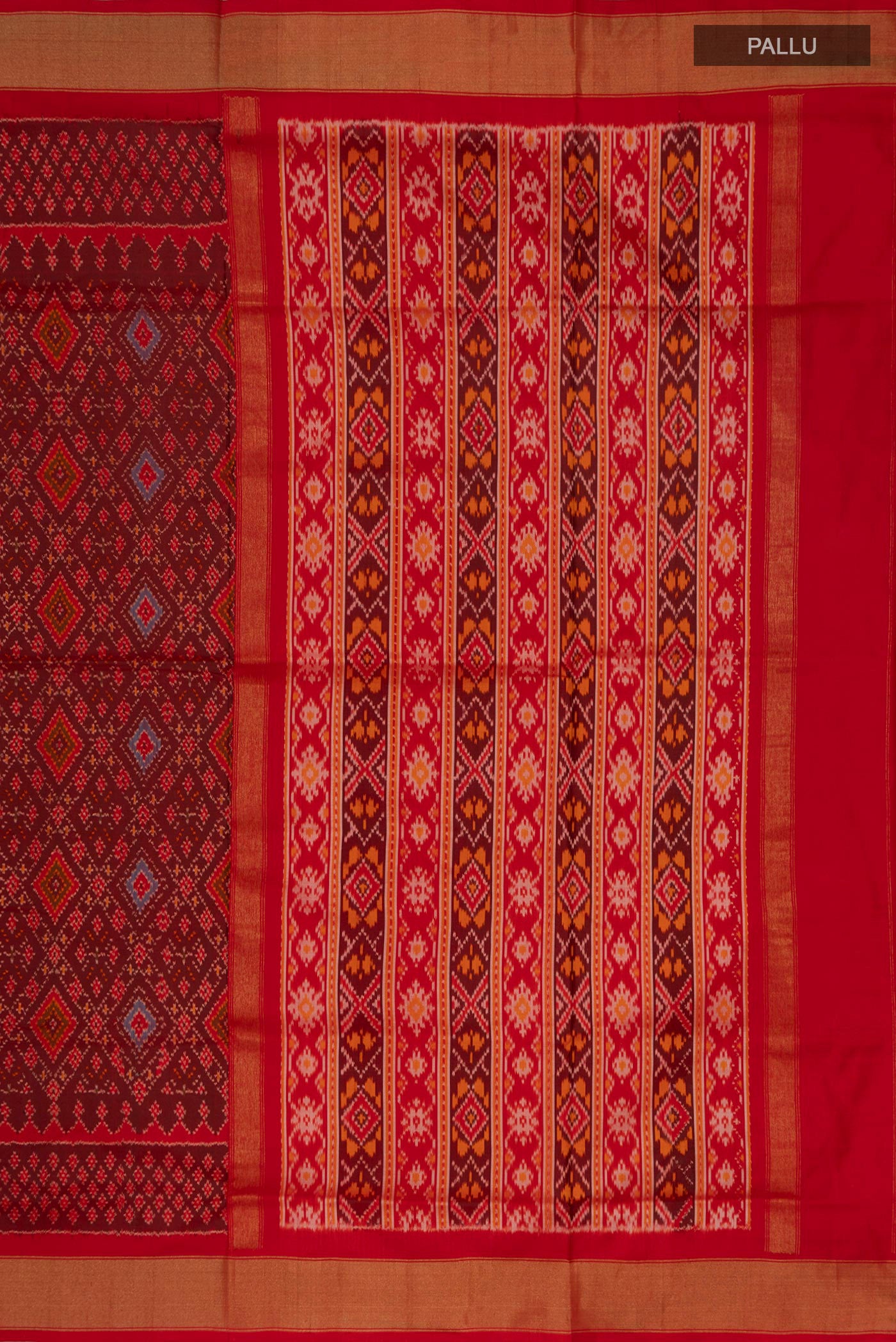 Close up image of the pallu of Red Pochampally Silk Saree with Ikat Print on the body and Zari Border. 