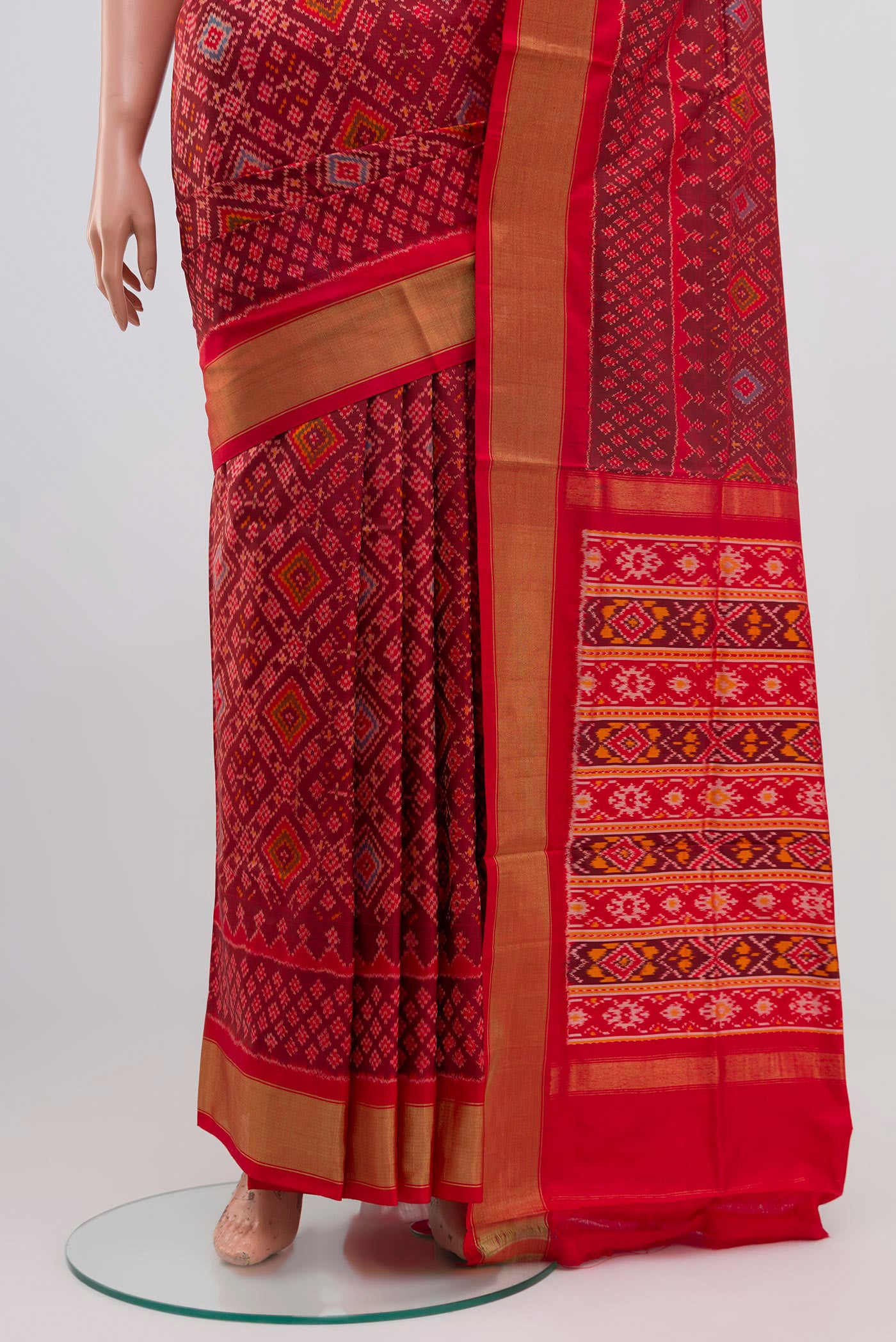 Pleats and pallu of Red Pochampally Silk Saree with Ikat Print on the body and Zari Border. 