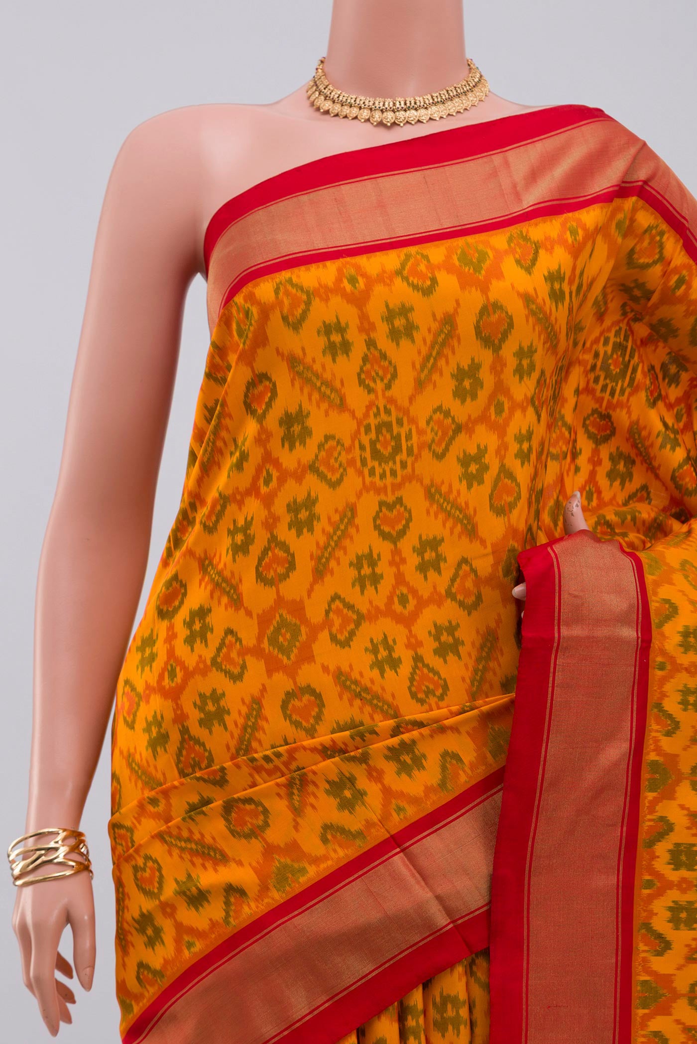 Border image of Yellow Pochampally Silk Saree with Ikat design on the body and Zari Border. 