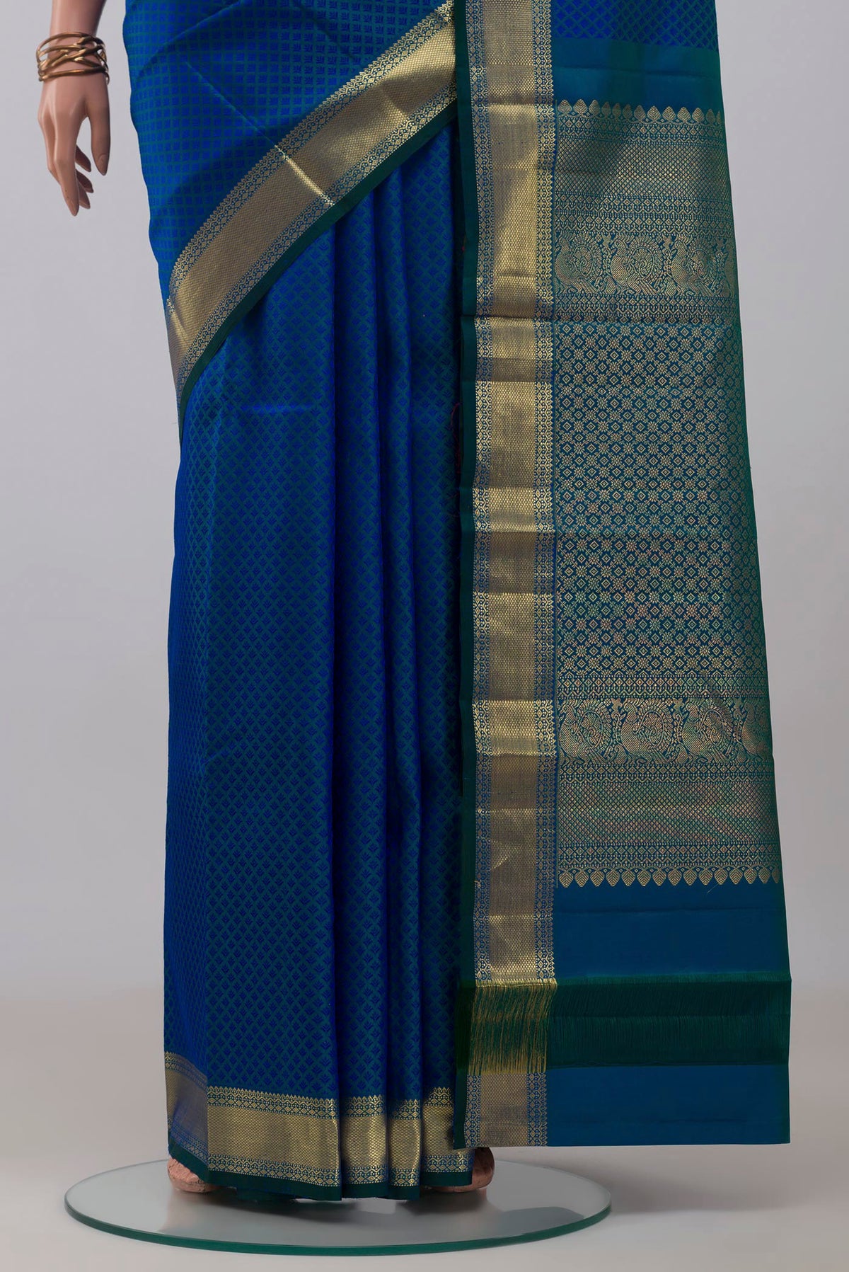 Pleats and pallu of Blue Kanjivaram Silk Saree with Jacquard design on the body and Zari Border. 