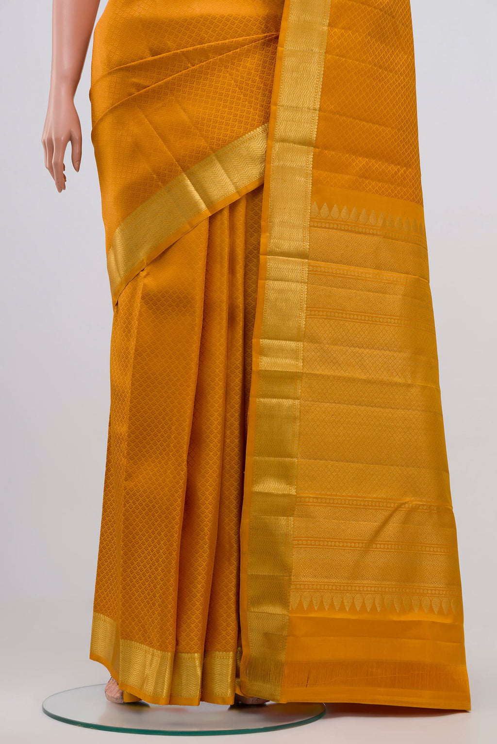 Pleats and pallu of Yellow Kanjivaram Silk Saree with Jacquard design on the body and Zari Border. 