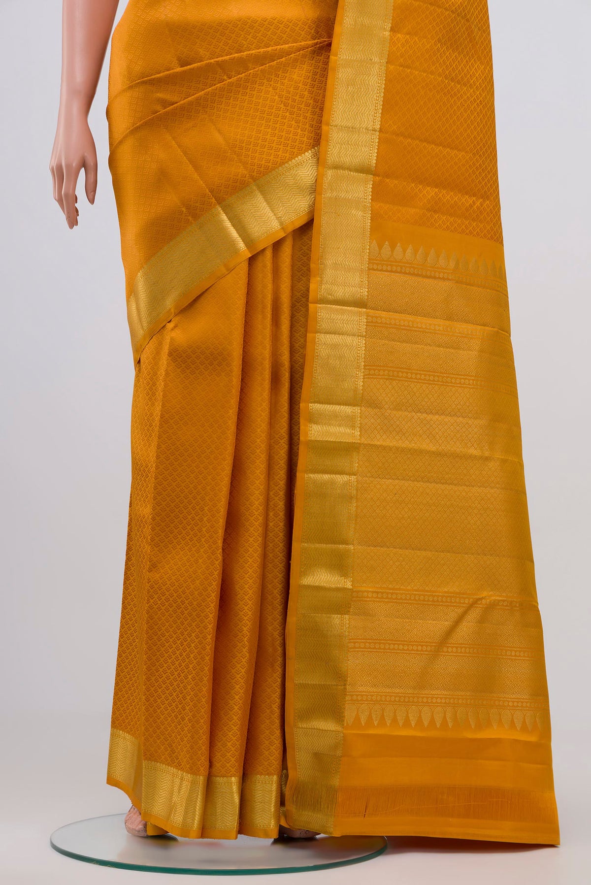 Pleats and pallu of Yellow Kanjivaram Silk Saree with Jacquard design on the body and Zari Border. 