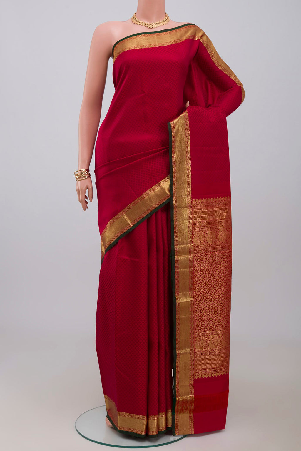 Red Kanjivaram Saree with Jacquard design on the body and Zari Border.  displayed on a mannequin