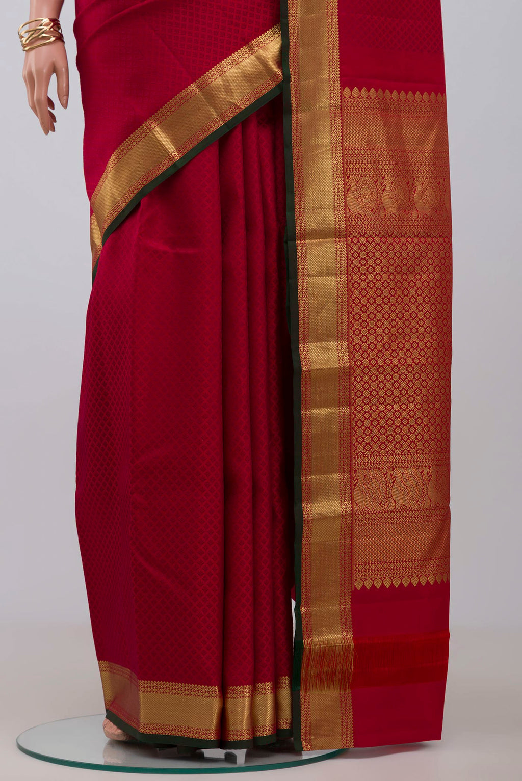 Pleats and pallu of Red Kanjivaram Saree with Jacquard design on the body and Zari Border. 