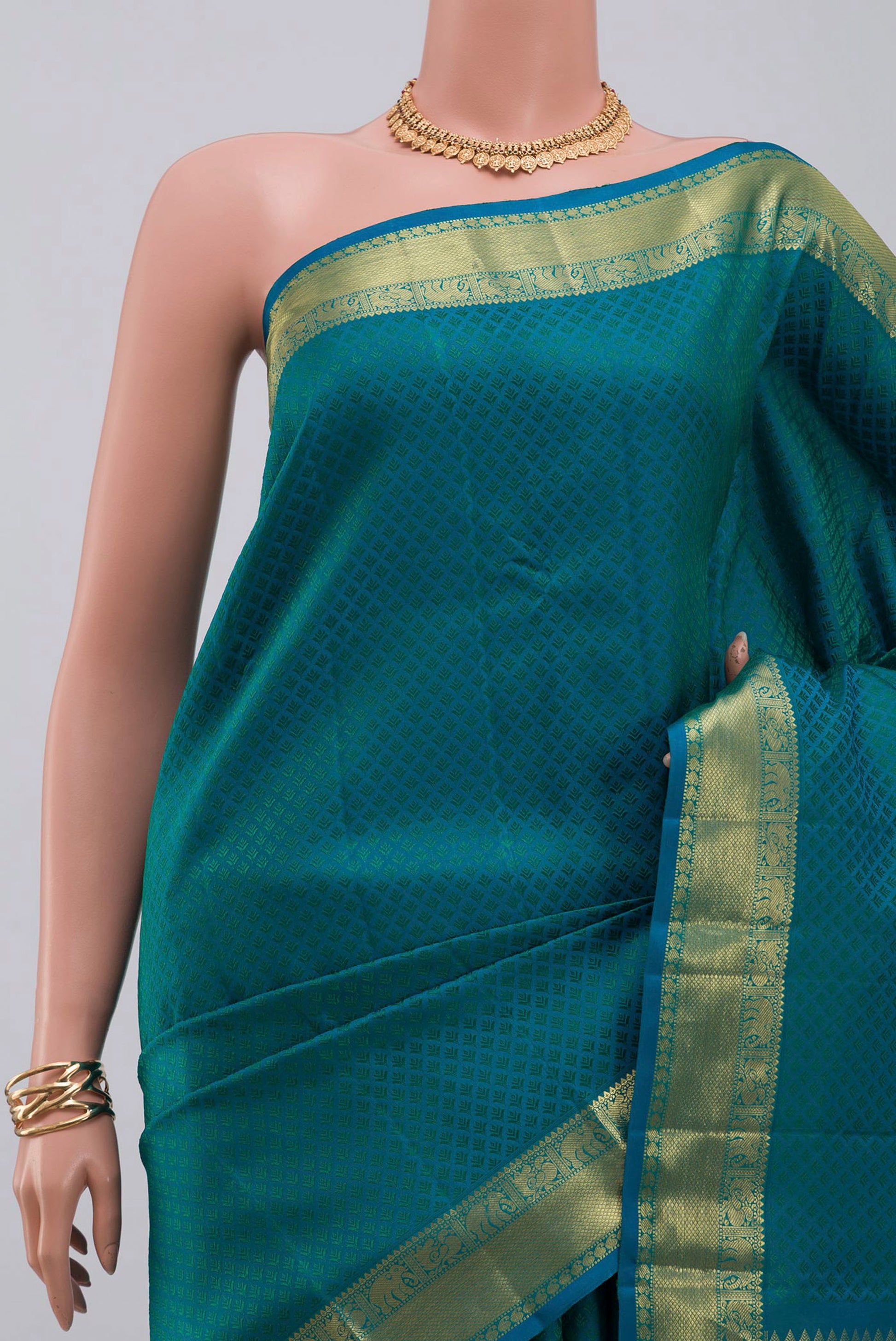 Border image of Blue Kanjivaram Saree with Jacquard design on the body and Zari Border. 