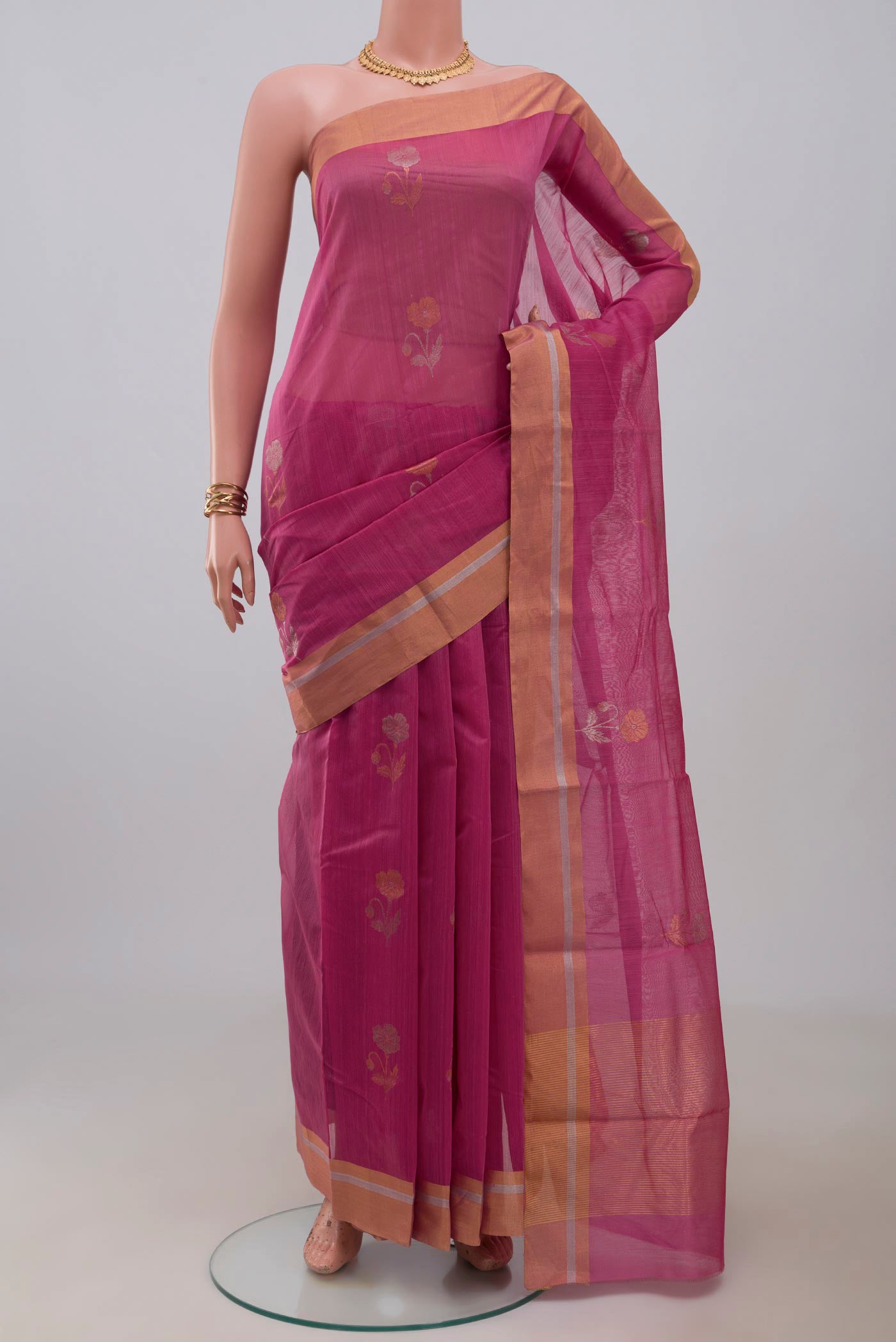Pink Chanderi Silk Cotton Saree with Zari Butta on the body and Zari Border.  displayed on a mannequin