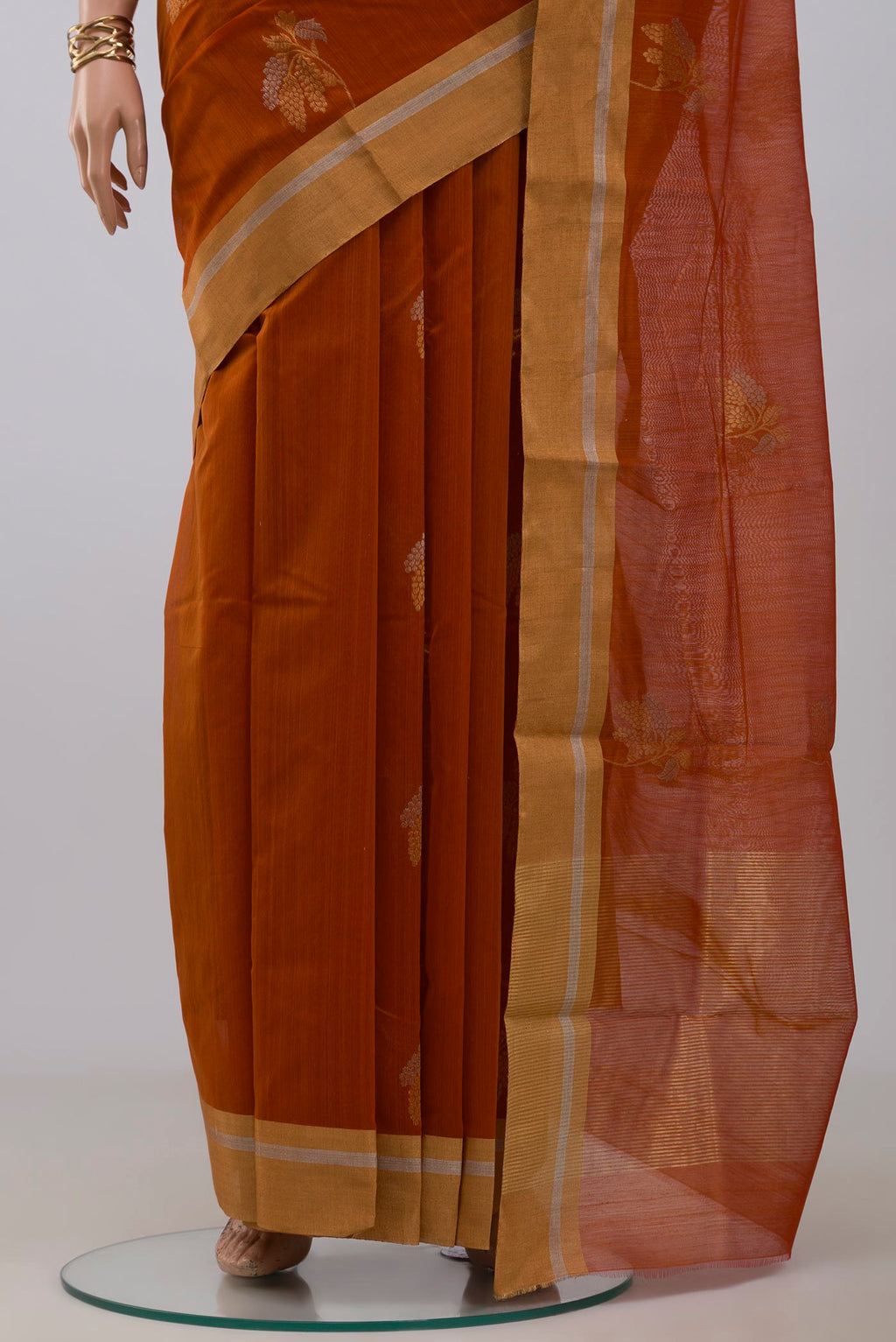 Pleats and pallu of Rust Chanderi Silk Cotton Saree with Zari Butta on the body and Zari Border. 