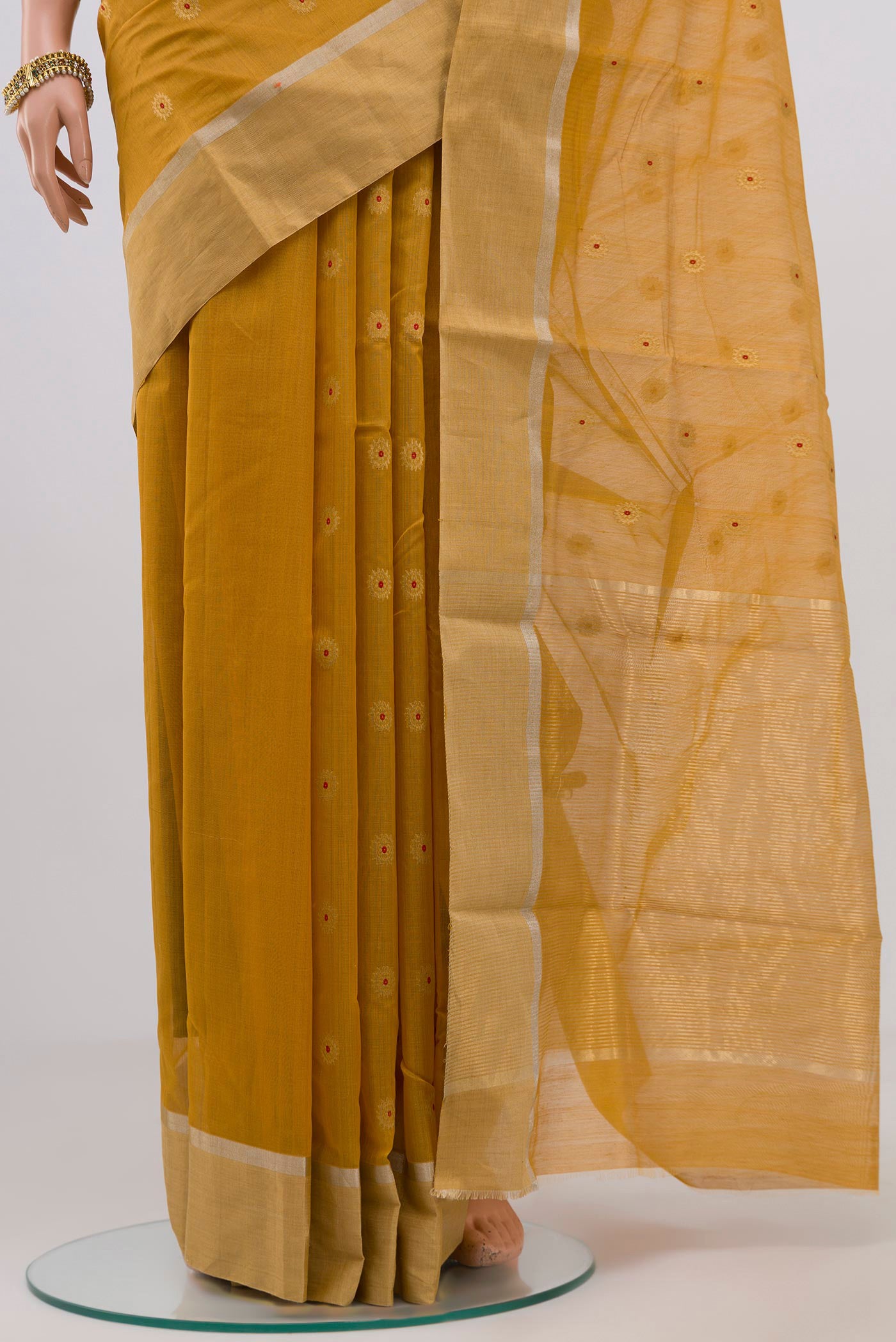 Pleats and pallu of Yellow Chanderi Silk Cotton Saree with Zari Butta on the body and Zari Border. 