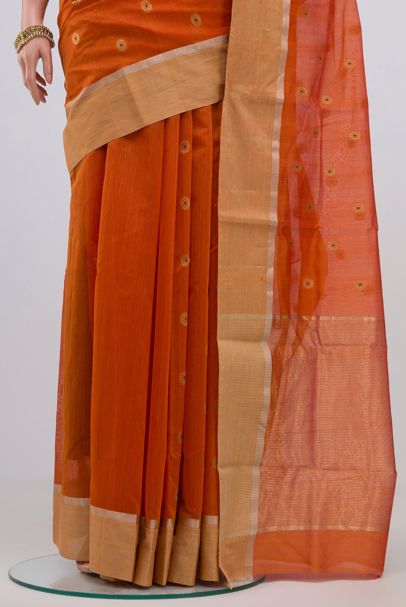 Pleats and pallu of Brick Orange Chanderi Silk Cotton Saree with Zari Butta on the body and Zari Border. 