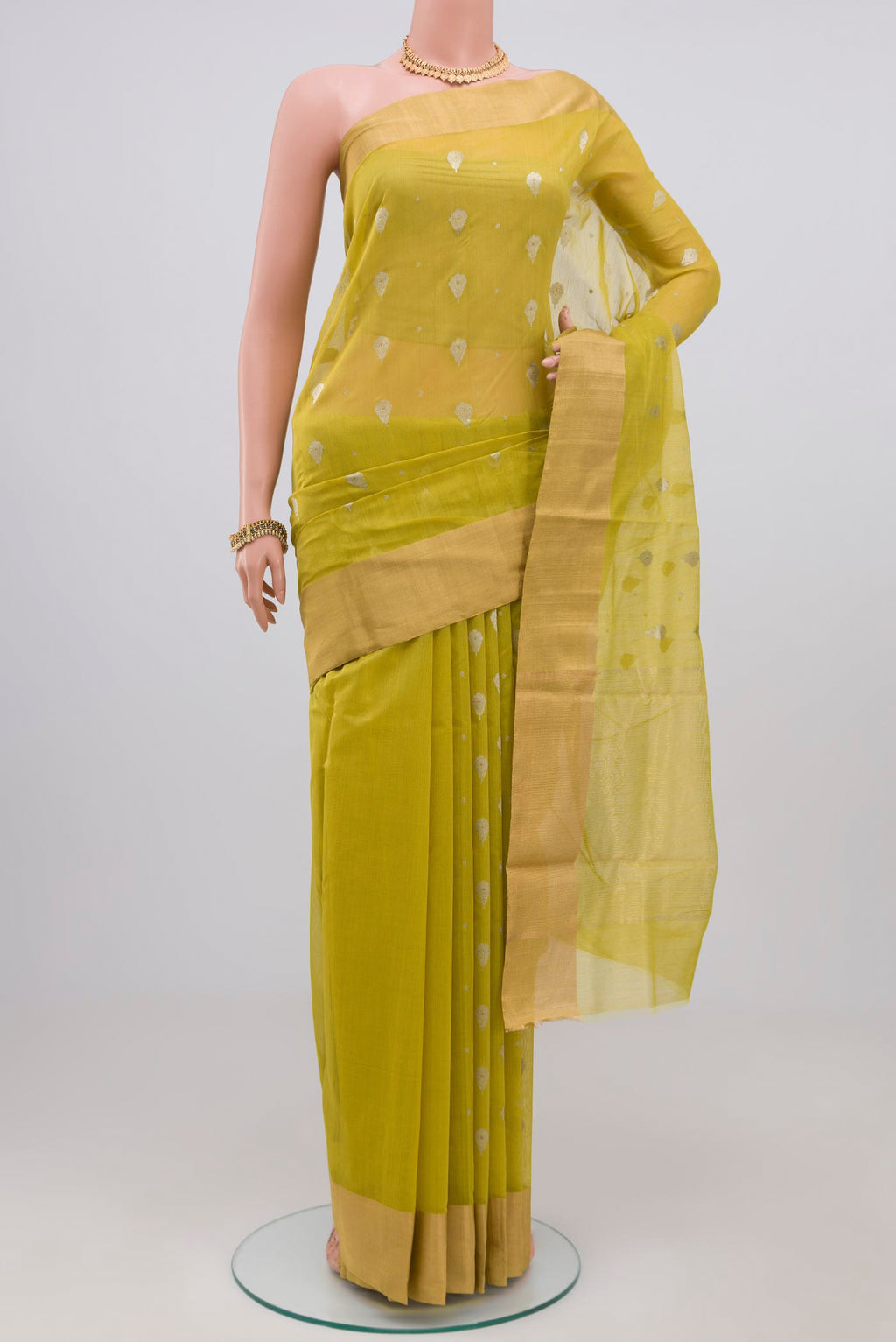 Lemon Yellow Chanderi Silk Cotton Saree with Zari Butta on the body and Zari Border.  displayed on a mannequin