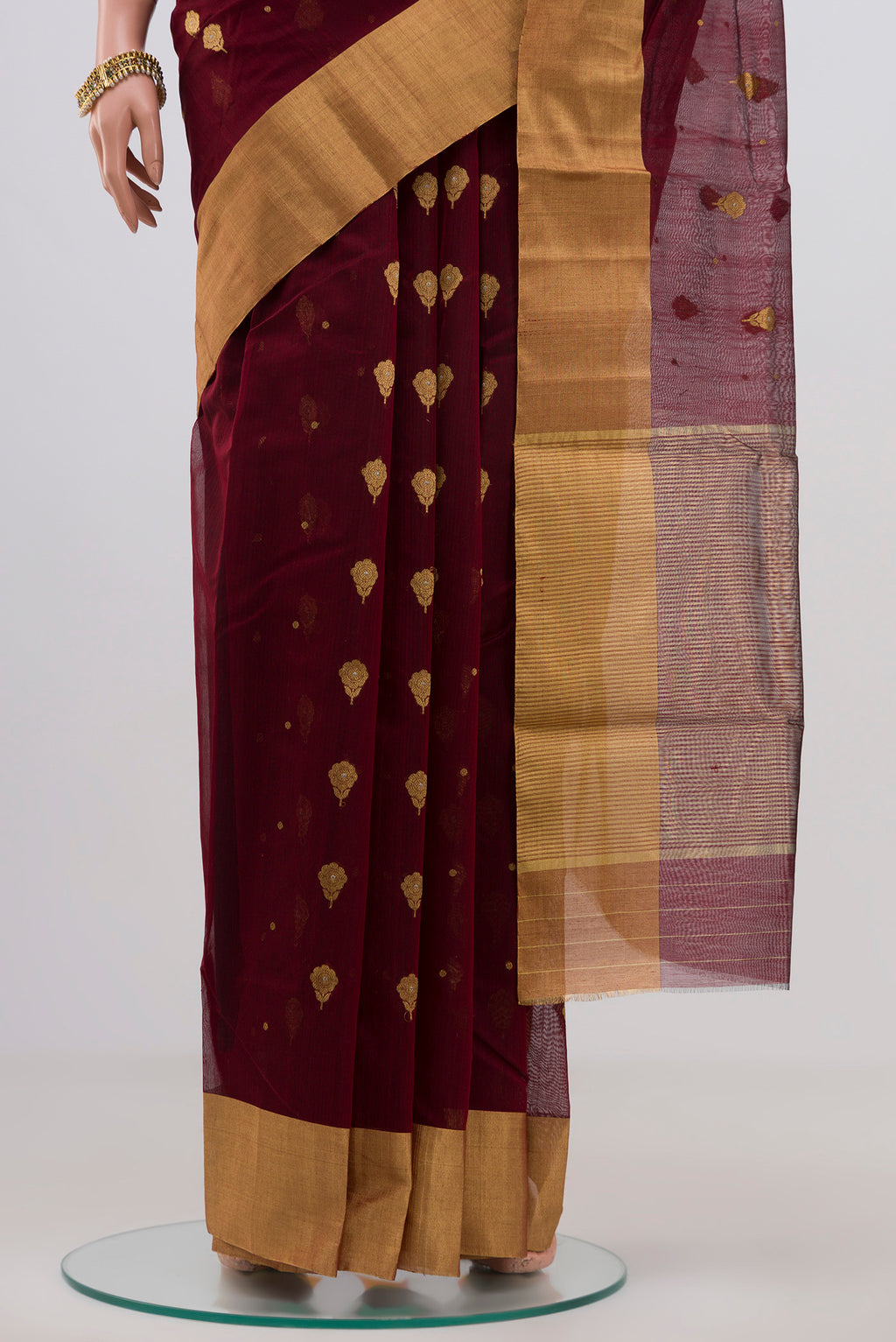 Pleats and pallu of Maroon Chanderi Silk Cotton Saree with Zari Butta on the body and Zari Border. 