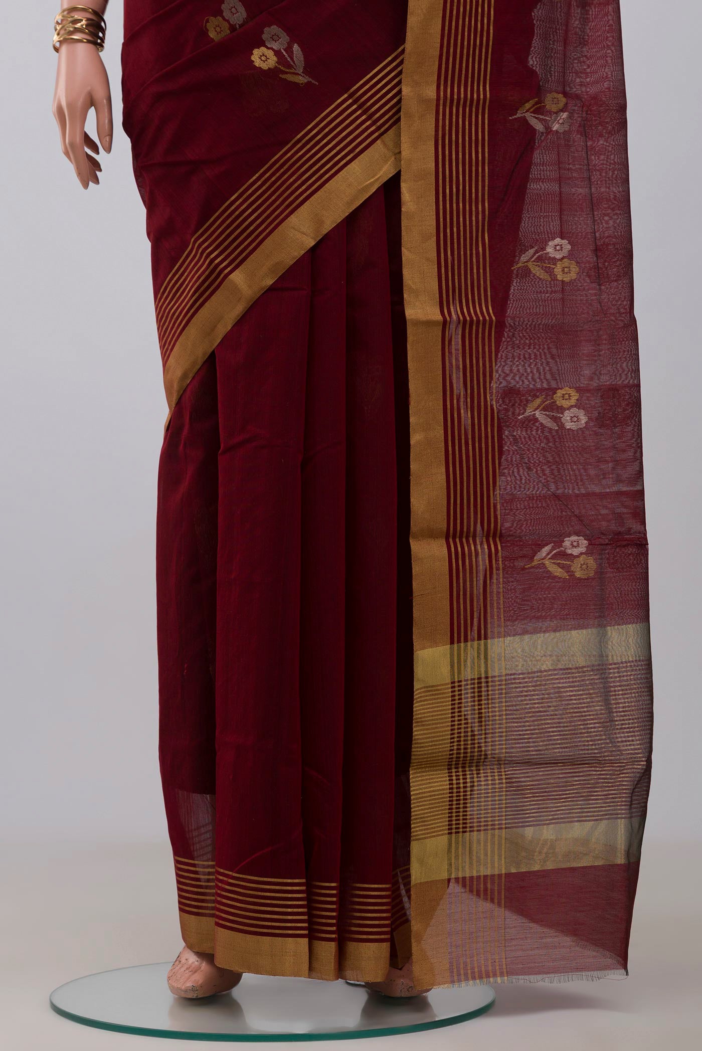 Pleats and pallu of Maroon Chanderi Silk Cotton Saree with Zari Butta on the body and Zari Border. 