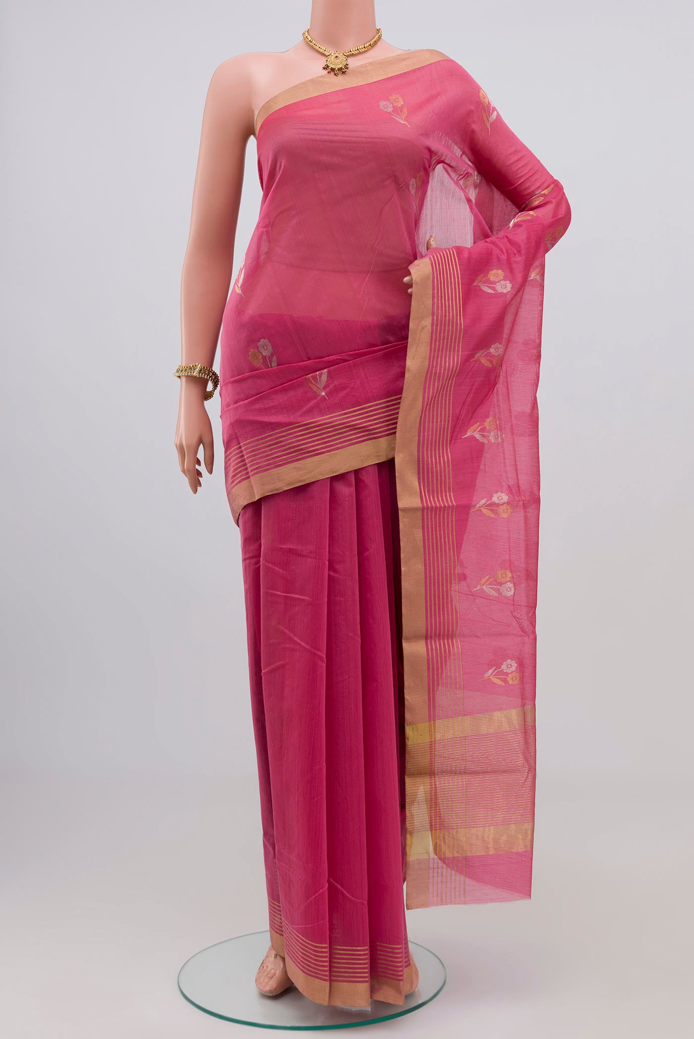 Pink Chanderi Silk Cotton Saree with Zari Butta on the body and Zari Border.  displayed on a mannequin