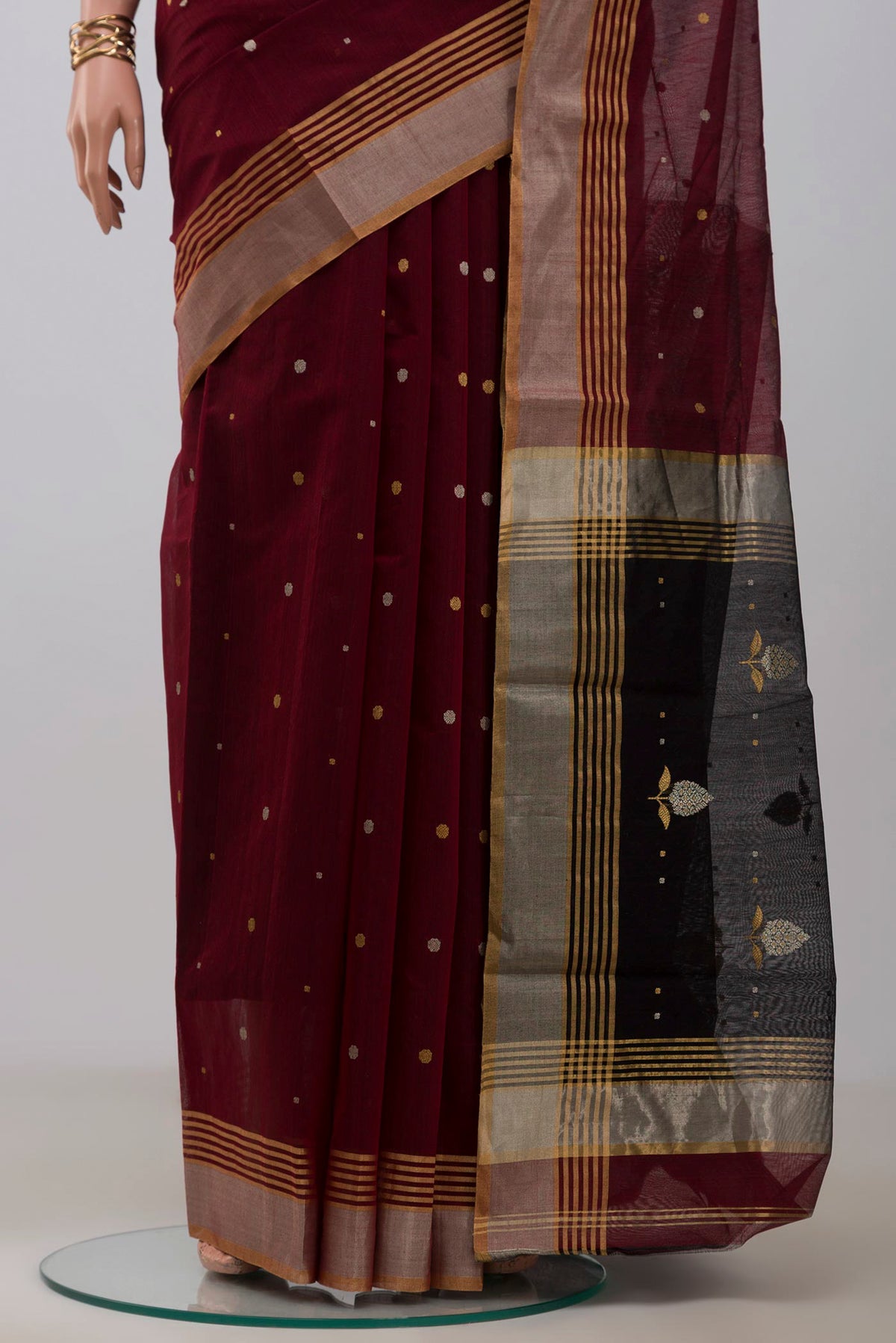 Pleats and pallu of Maroon Chanderi Silk Cotton Saree with Zari Butta on the body and Zari Border. 
