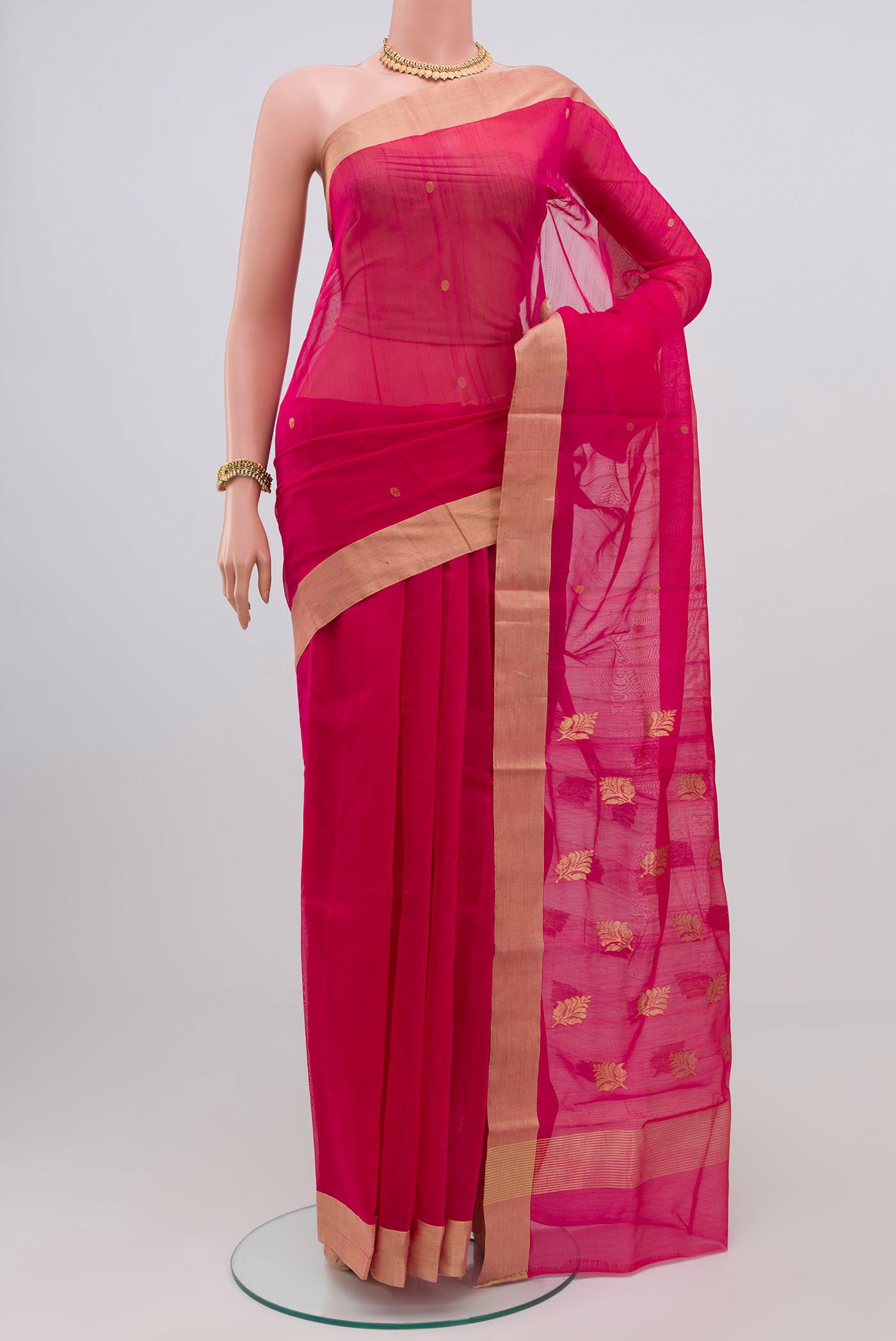 Dark Pink Chanderi Silk Cotton Saree with Zari Butta on the body and Zari Border.  displayed on a mannequin