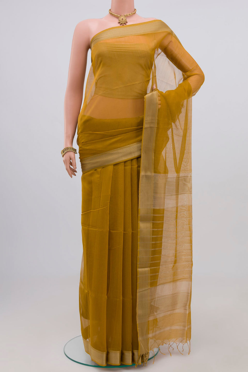 Mustard Maheshwari Silk Cotton Saree with Plain Body and Thread Border.  displayed on a mannequin